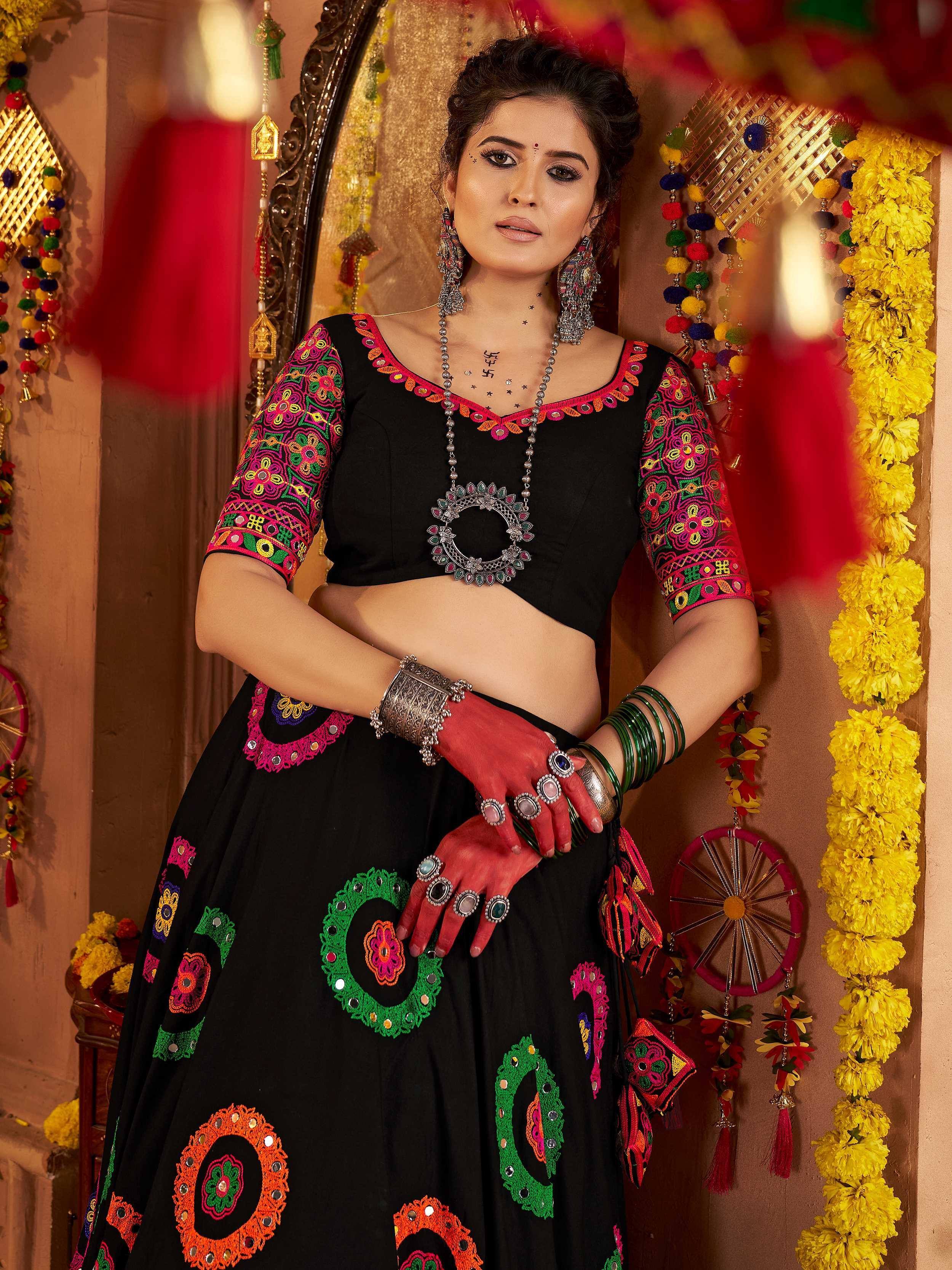 Black embroidered lehenga choli with colorful mirror work, traditional Indian ethnic wear for festive occasions