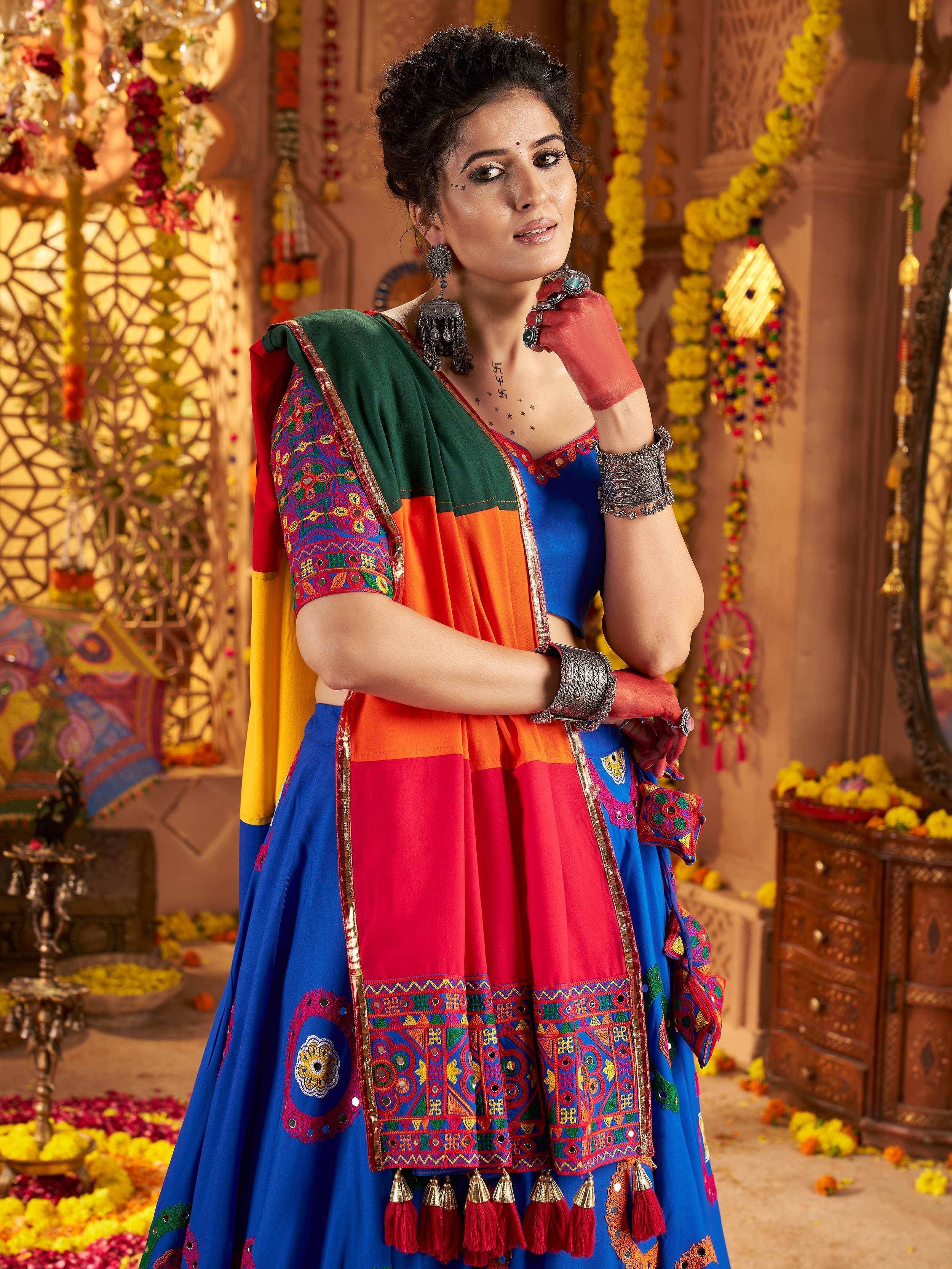 Vibrant Indian ethnic lehenga choli with colorful embroidery, mirror work, and tassels, perfect for festive occasions.
