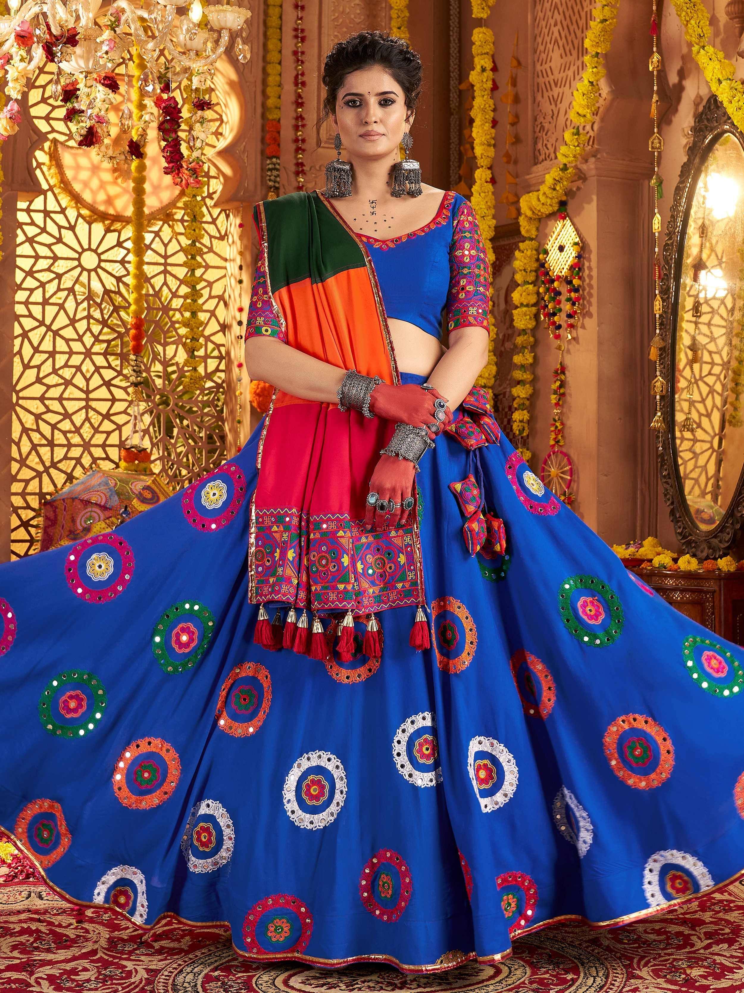 Vibrant blue lehenga choli with colorful mirror work, perfect for Indian ethnic occasions and festivals.