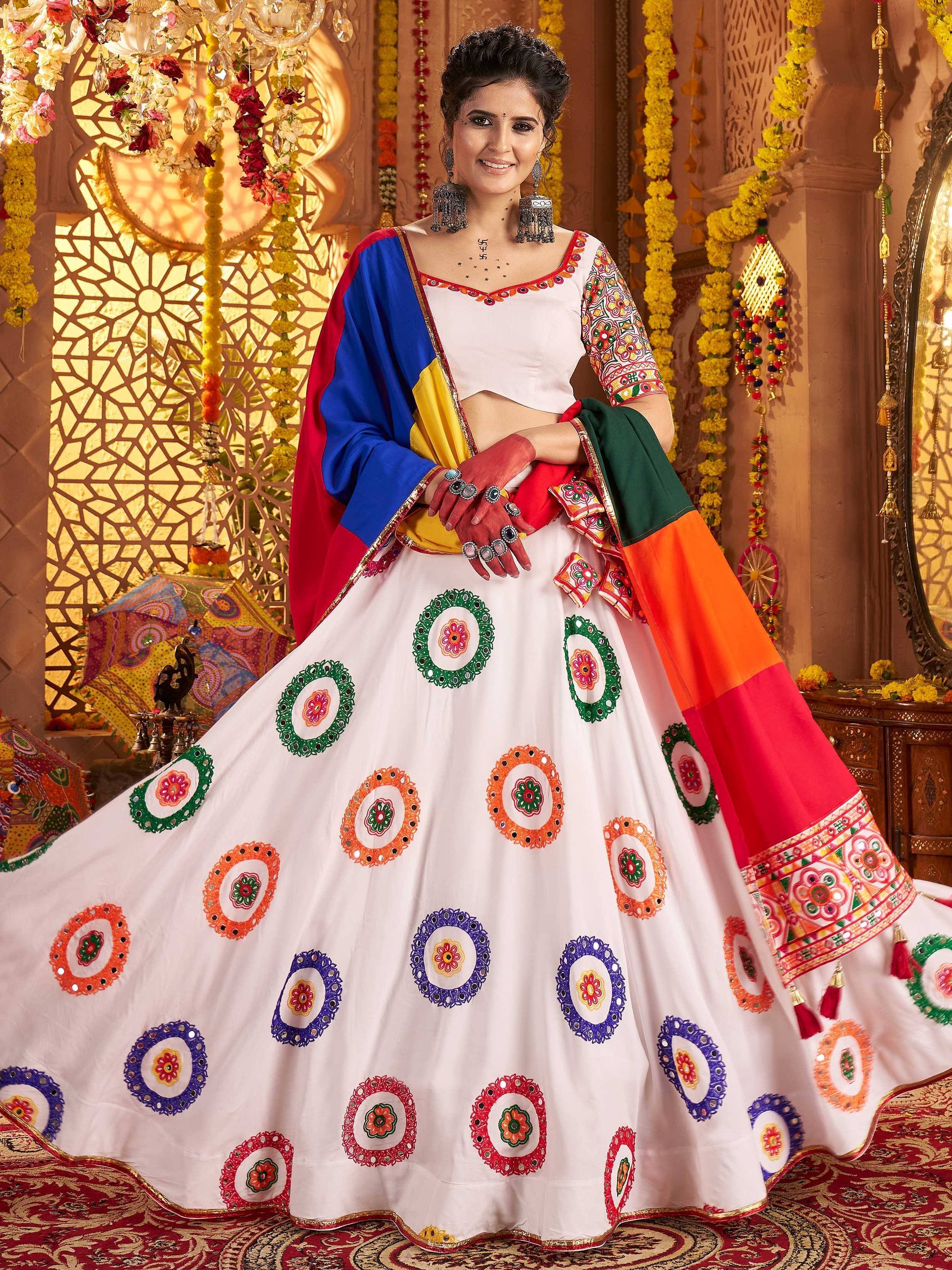 Woman in vibrant Indian ethnic lehenga choli with colorful embroidery, perfect for festive occasions.