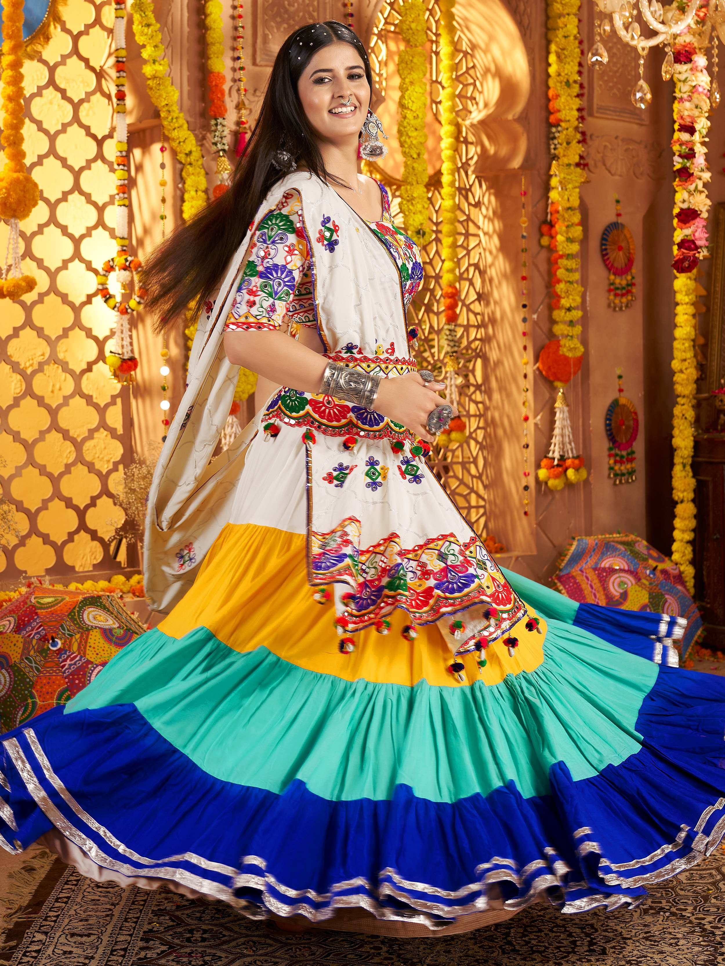 Colorful embroidered Indian ethnic lehenga choli with mirror work, perfect for festive occasions and celebrations.