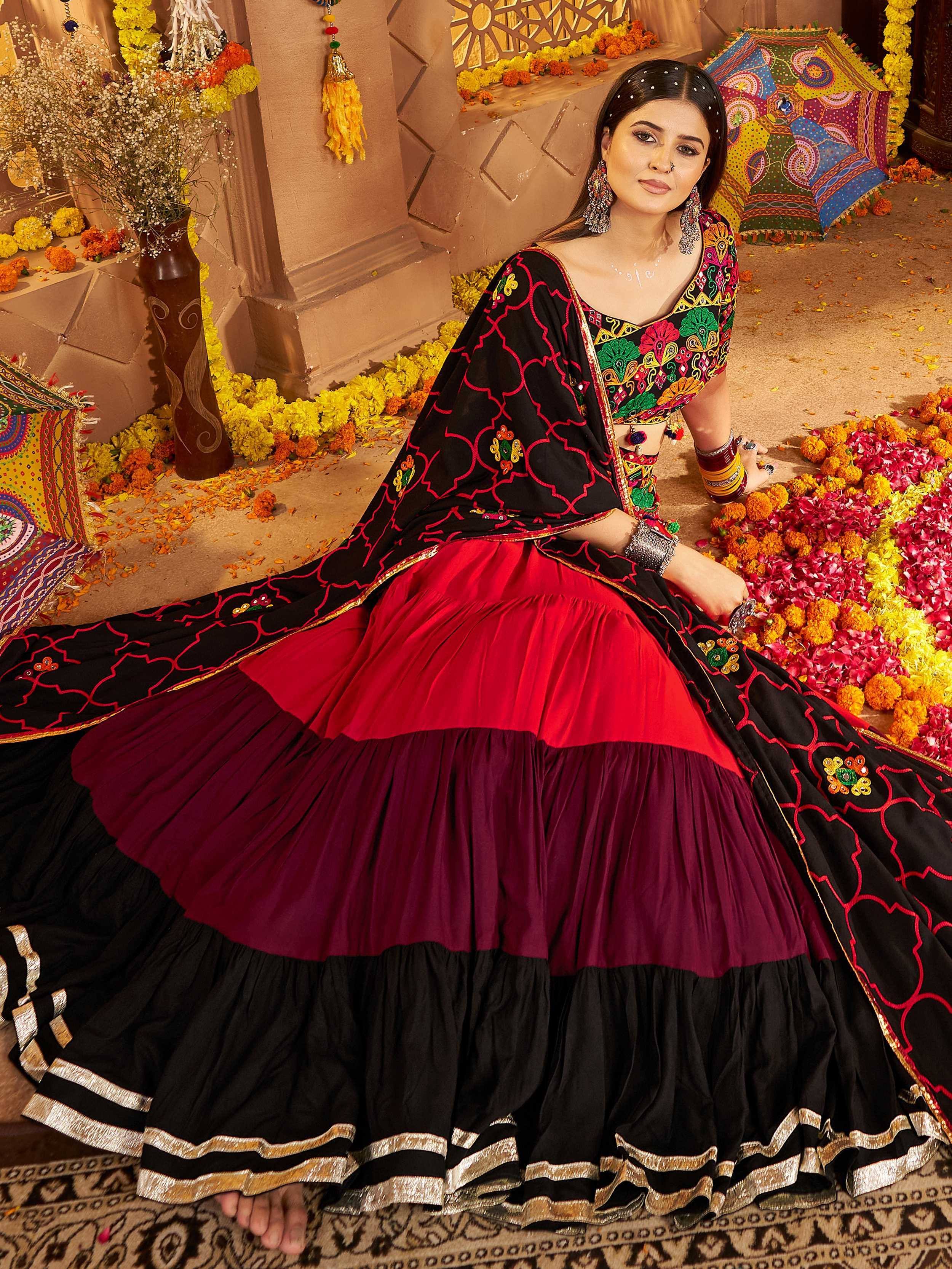 Black and red embroidered lehenga choli with colorful floral motifs, perfect for Indian ethnic wear occasions.