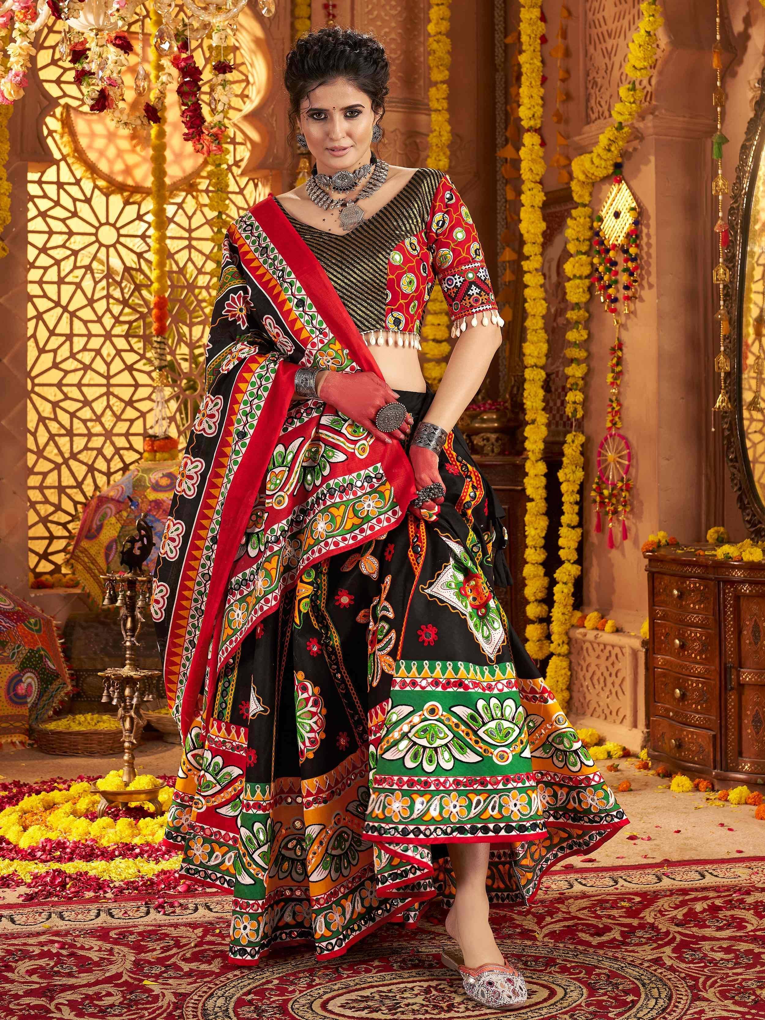 Woman in vibrant Indian ethnic lehenga choli with mirror work, floral prints, and traditional jewelry, festive decor background