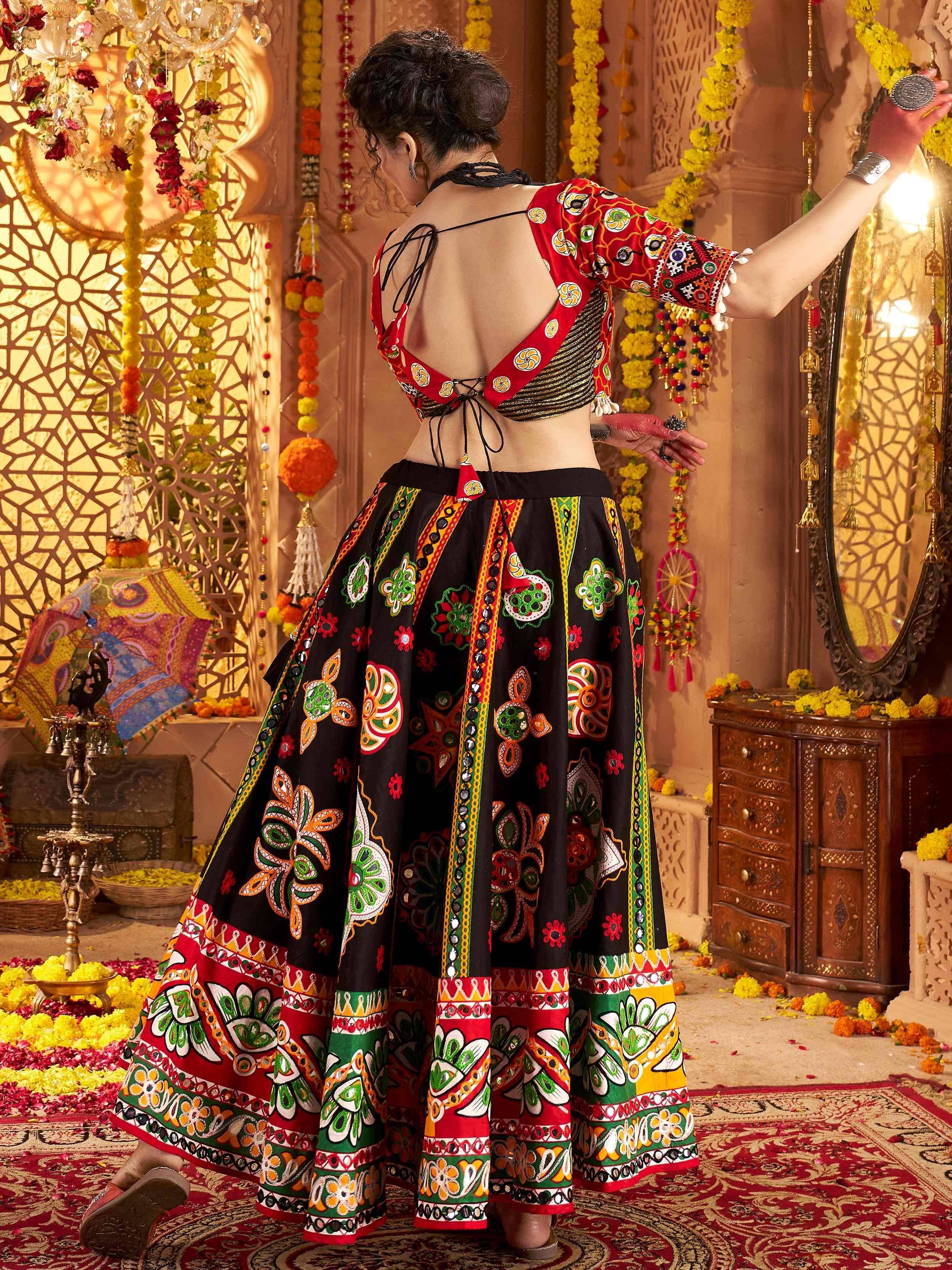 Vibrant Indian ethnic lehenga choli with mirror work, floral motifs, and back tie blouse, perfect for festive occasions.