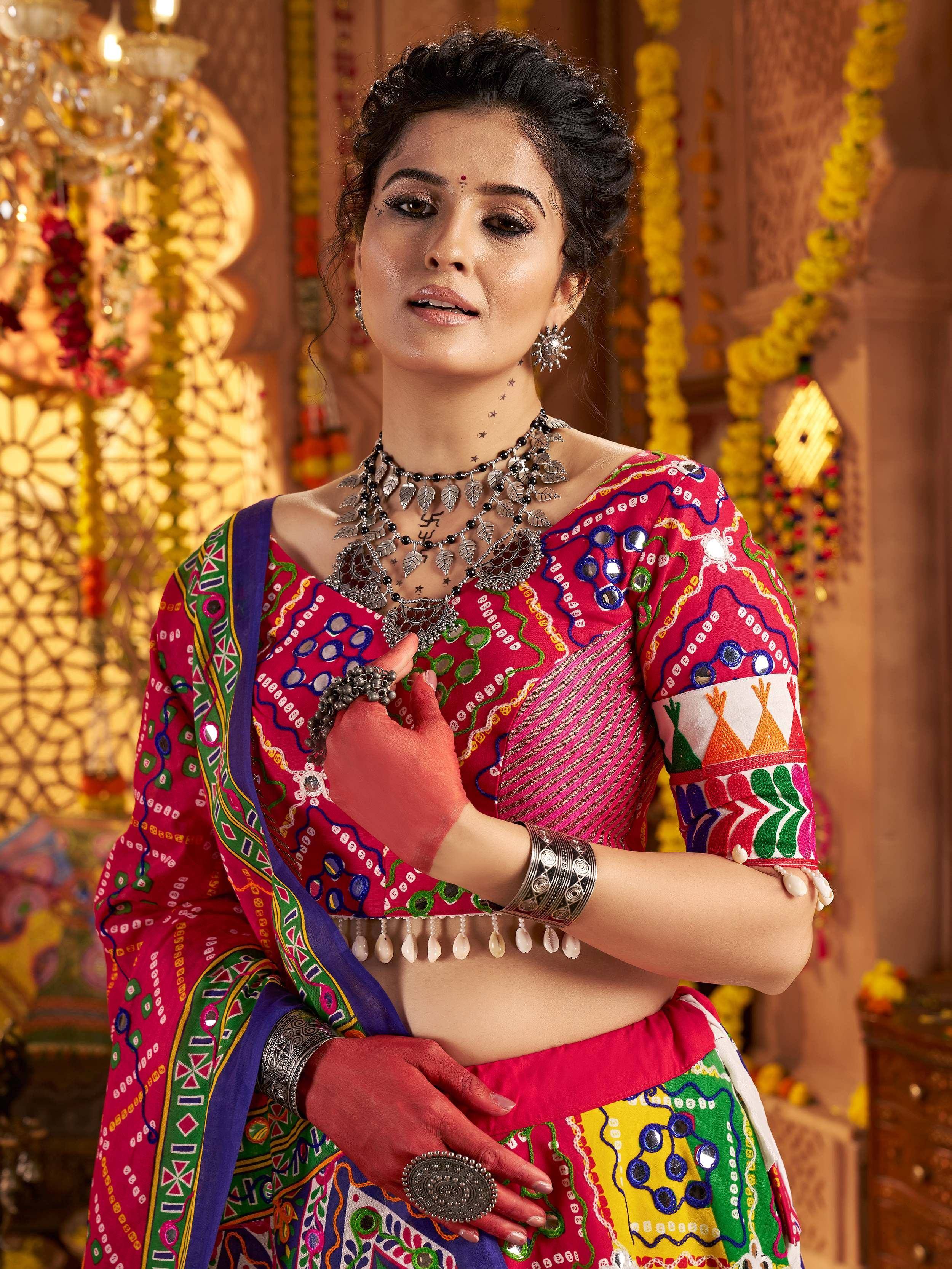 Vibrant Indian ethnic wear with mirror work, colorful embroidery, and traditional jewelry for festive occasions