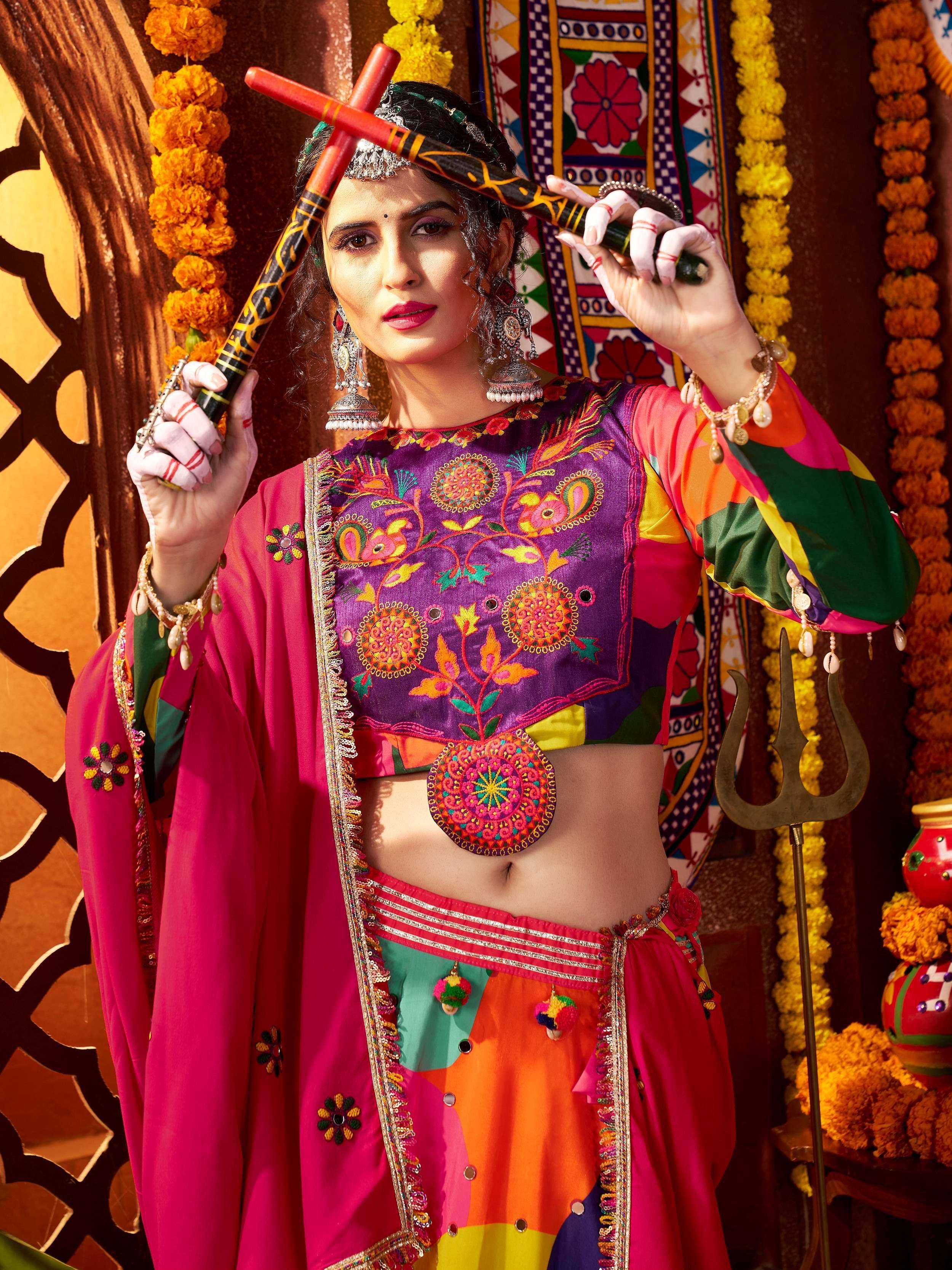 Vibrant Indian ethnic wear with colorful embroidery, traditional jewelry, and festive marigold decor
