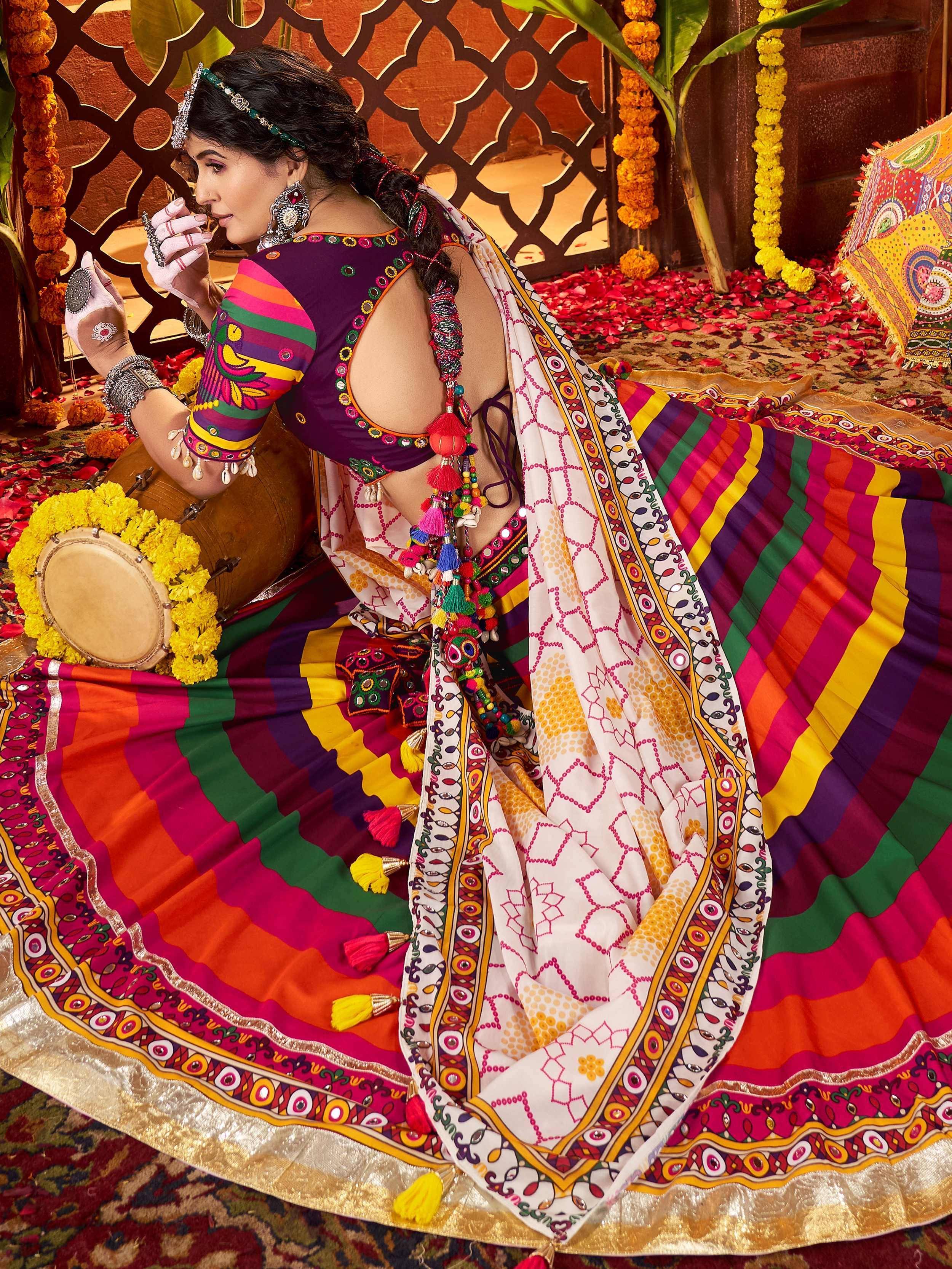 Vibrant Indian ethnic wear with colorful striped lehenga, mirror work, and tassels, perfect for festive occasions.