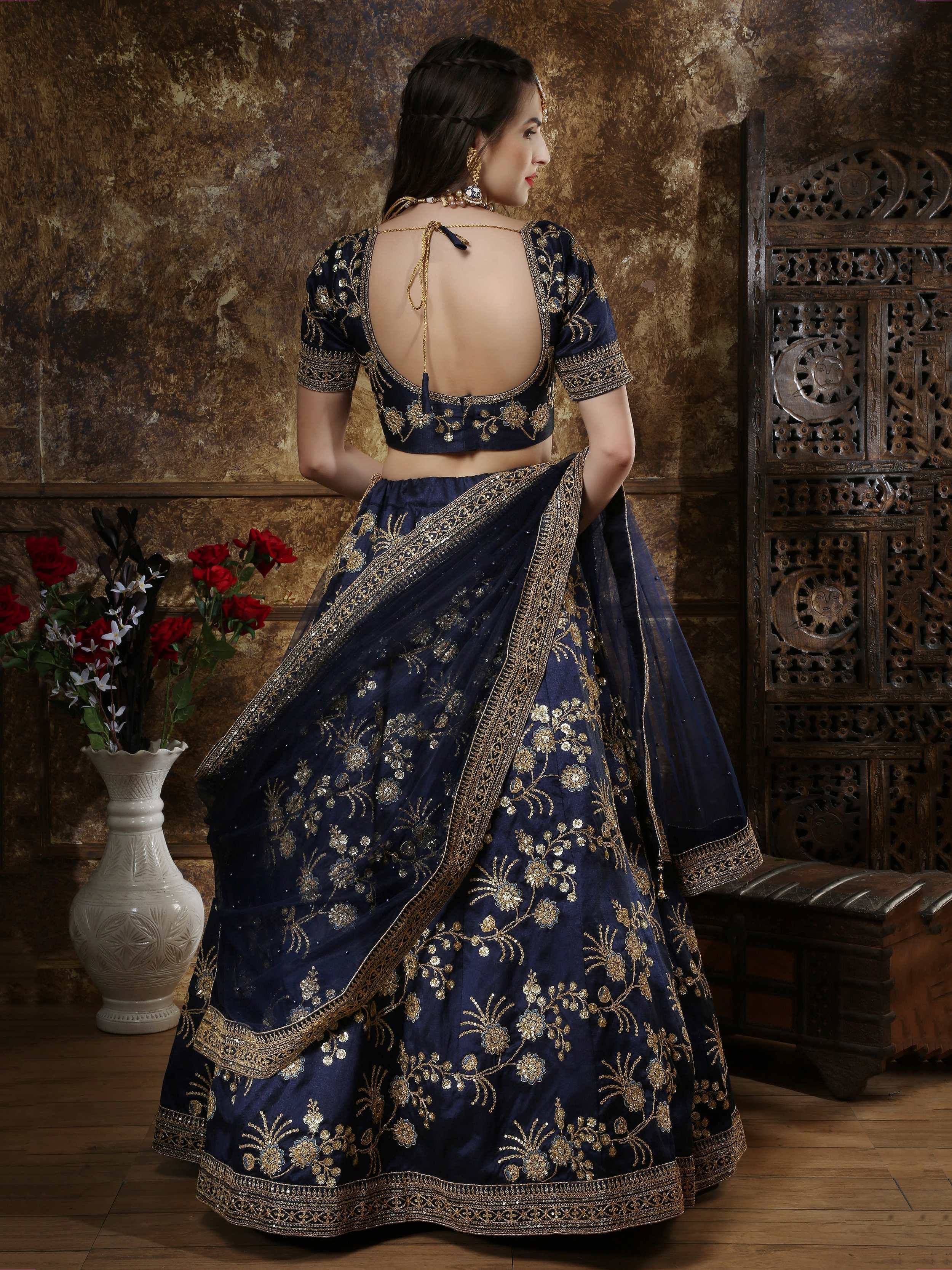 Navy blue designer lehenga choli with gold embroidery, back view, ethnic wear for weddings