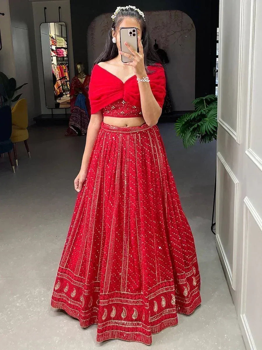 Red embroidered lehenga choli with off-shoulder blouse, perfect for Indian weddings and festive occasions