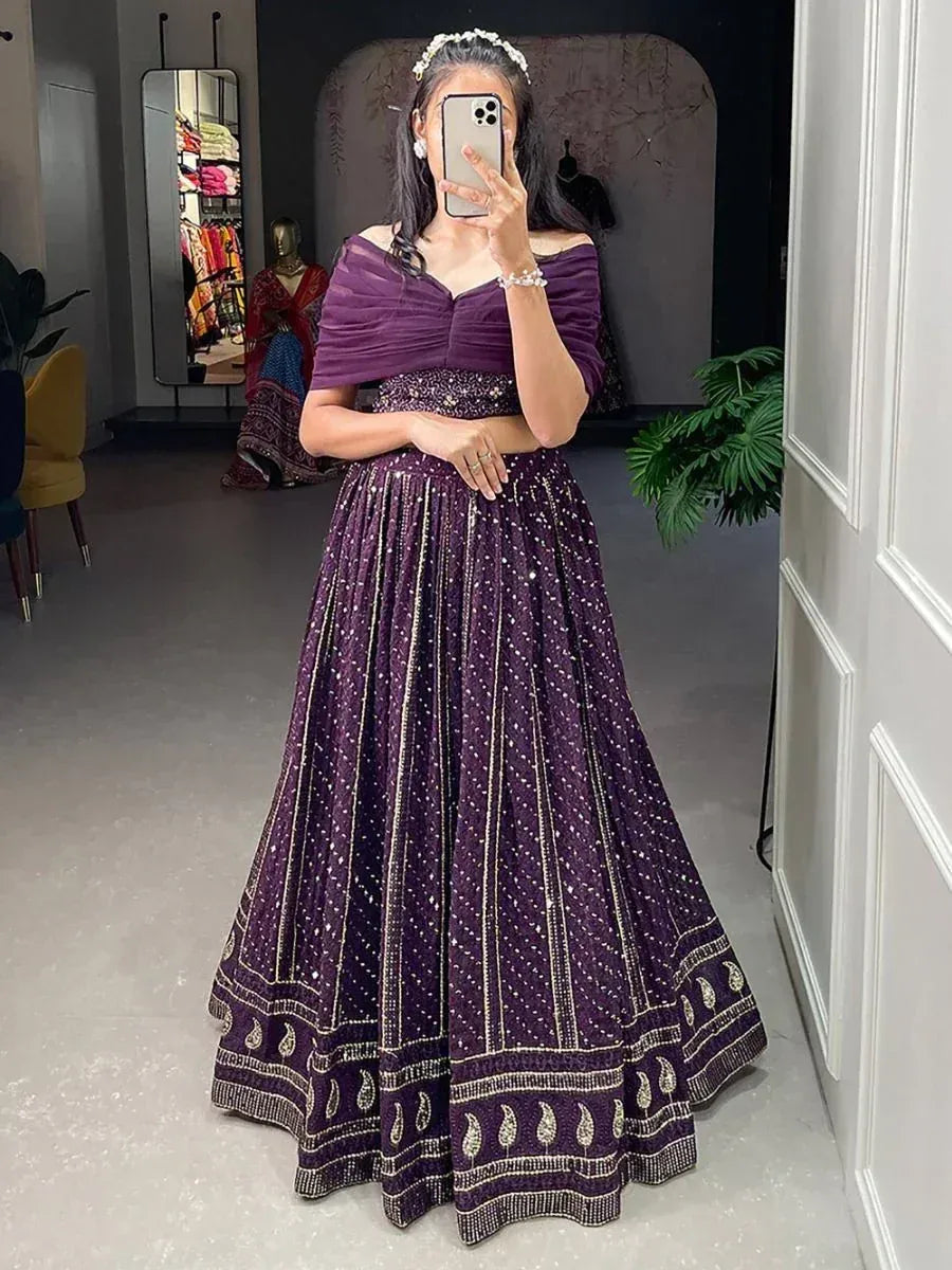 Purple off-shoulder lehenga choli with gold embroidery, perfect for Indian ethnic wear occasions