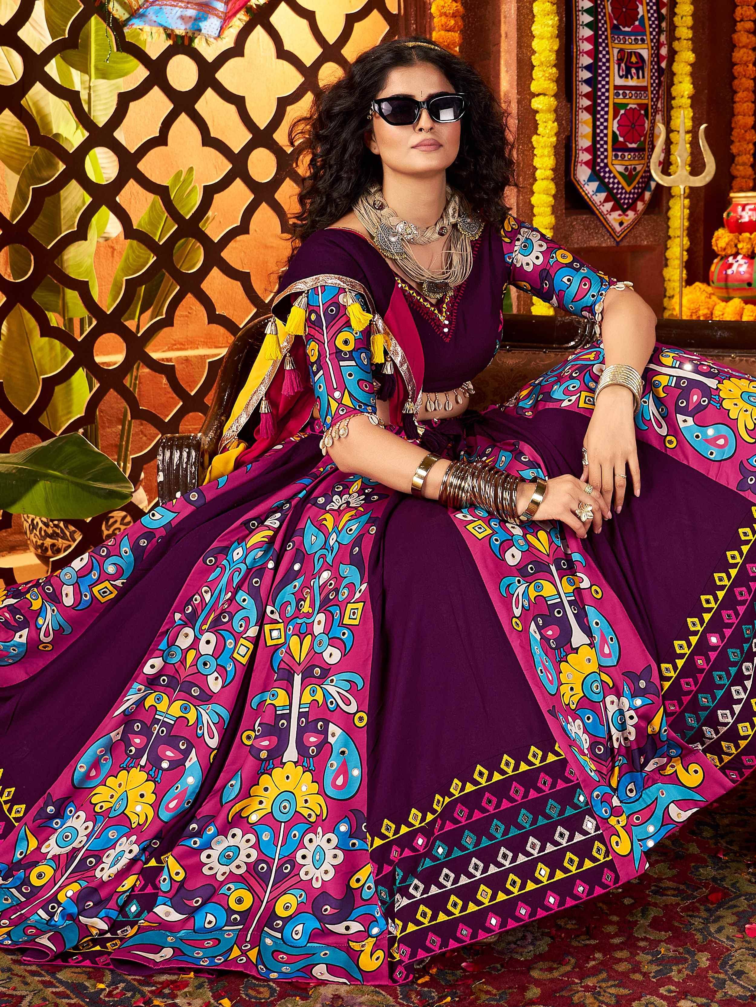 Vibrant purple and pink printed lehenga choli with peacock motifs, perfect for Indian ethnic wear occasions.