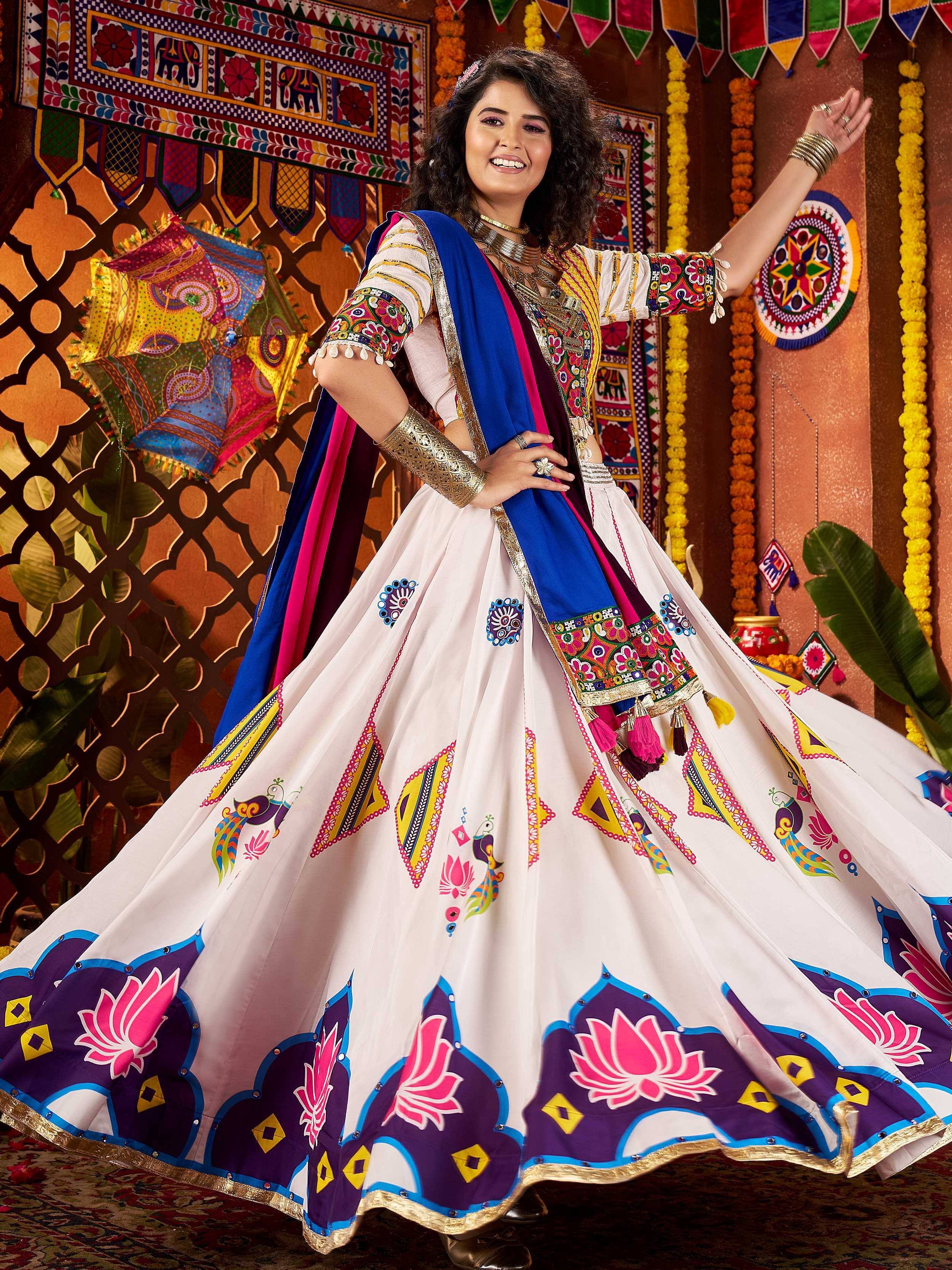 Woman in vibrant Indian ethnic wear with floral and peacock print, perfect for festive occasions