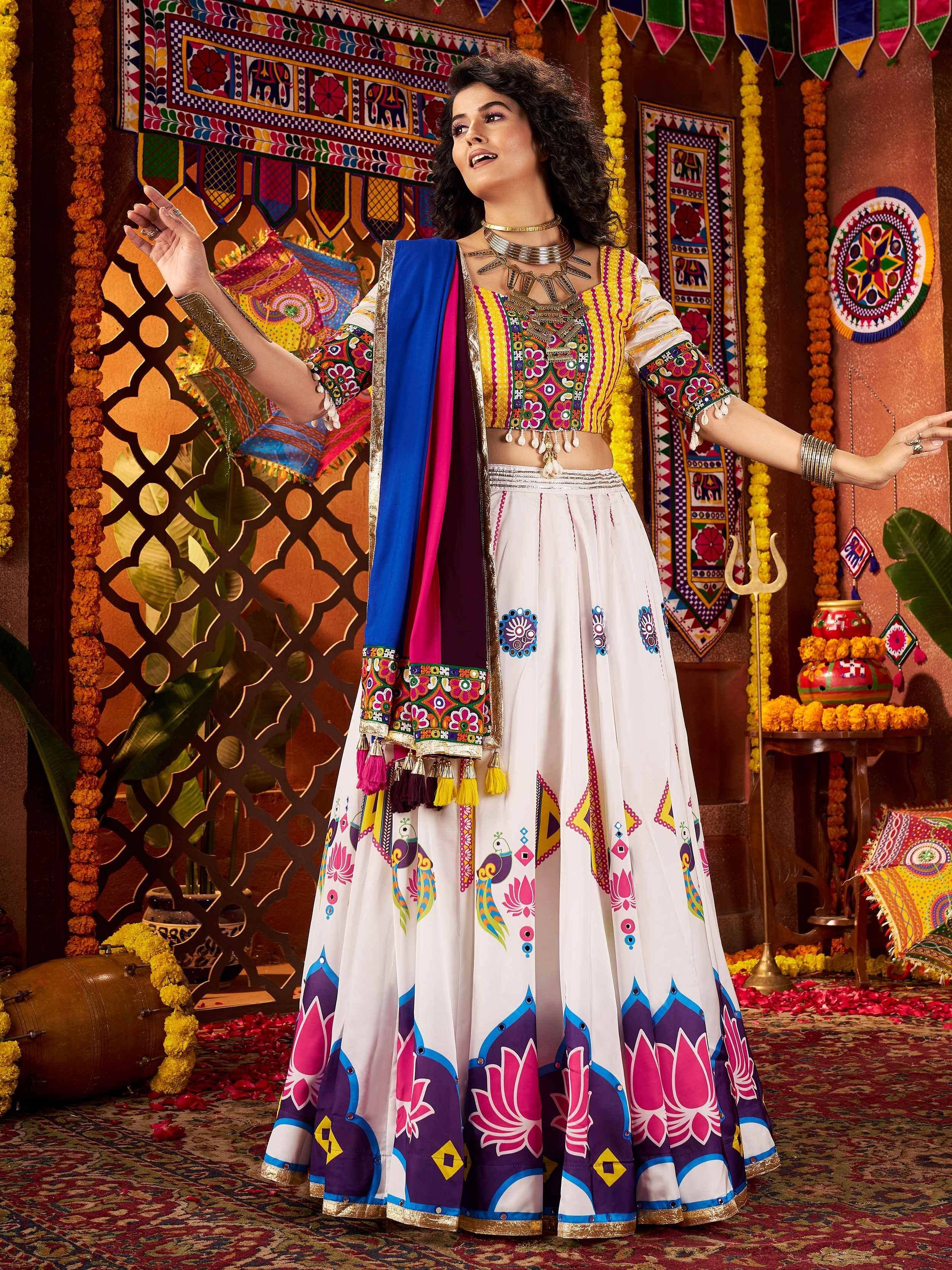 Woman in colorful embroidered Indian lehenga choli with peacock and lotus print, festive ethnic wear