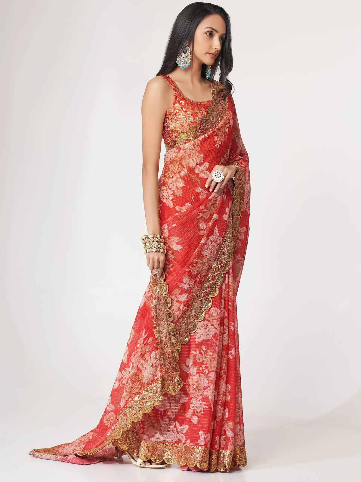 Red floral saree with gold embroidery, perfect for Indian ethnic wear and festive occasions.