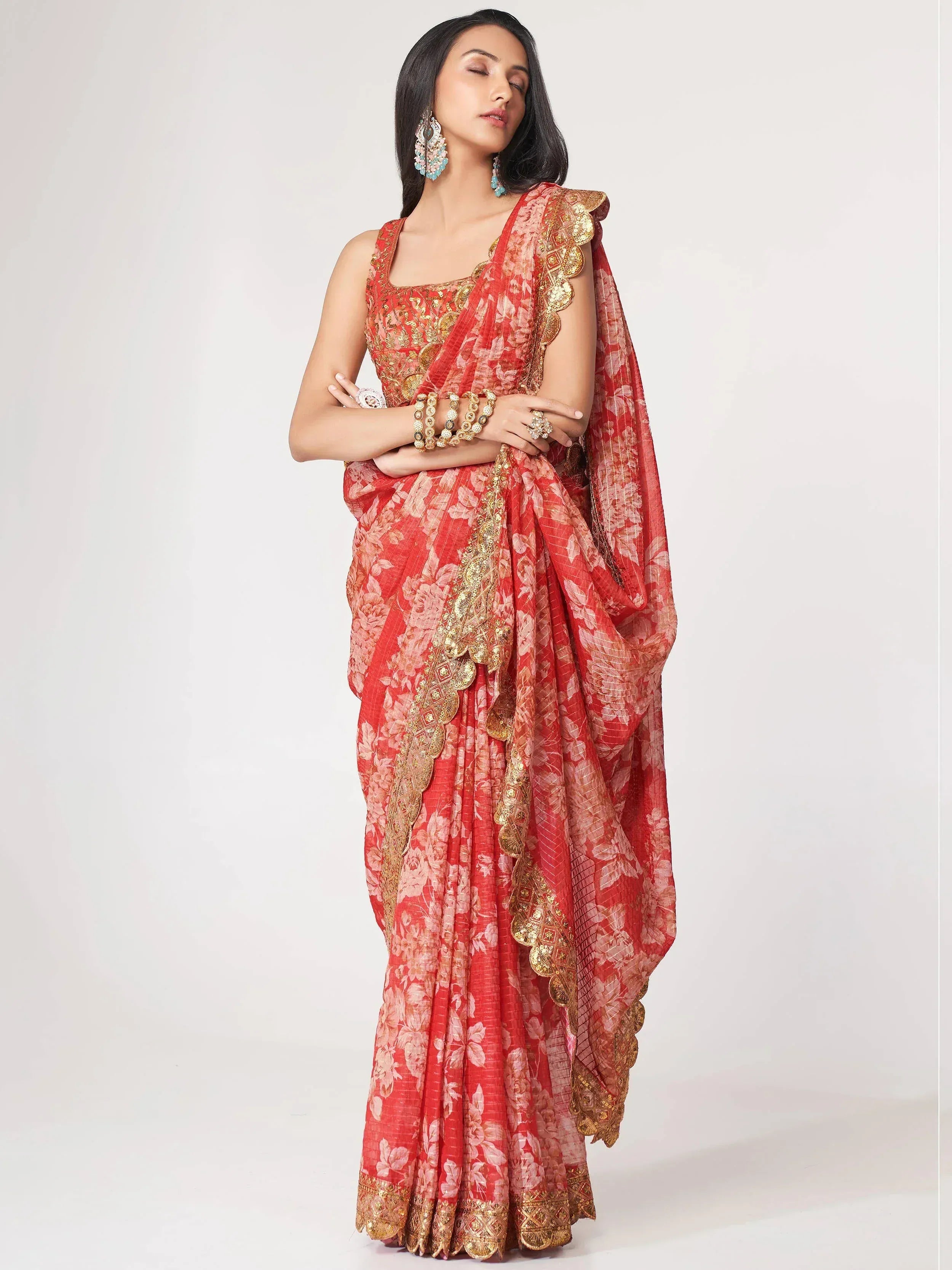 Red floral saree with gold embroidery, perfect for Indian ethnic wear occasions