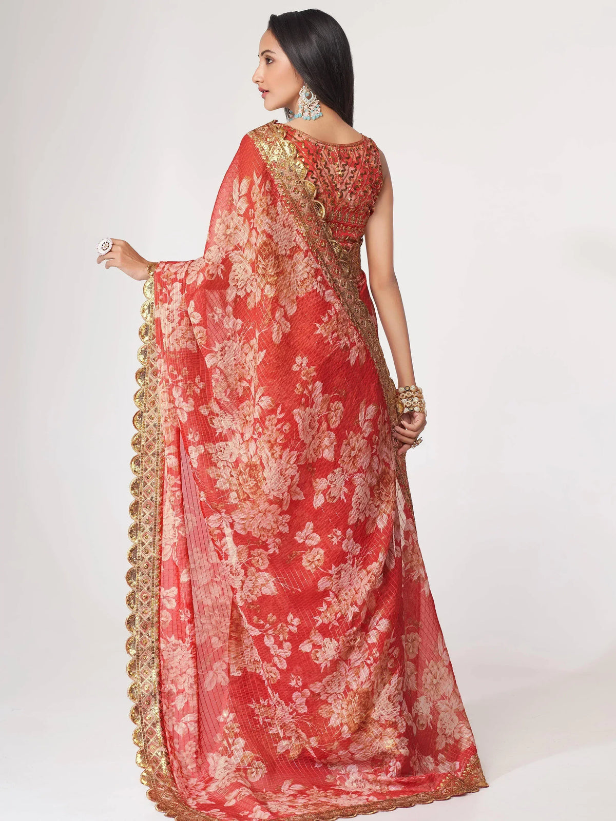 Red floral ethnic gown with gold embroidery, perfect for Indian weddings and festive occasions.