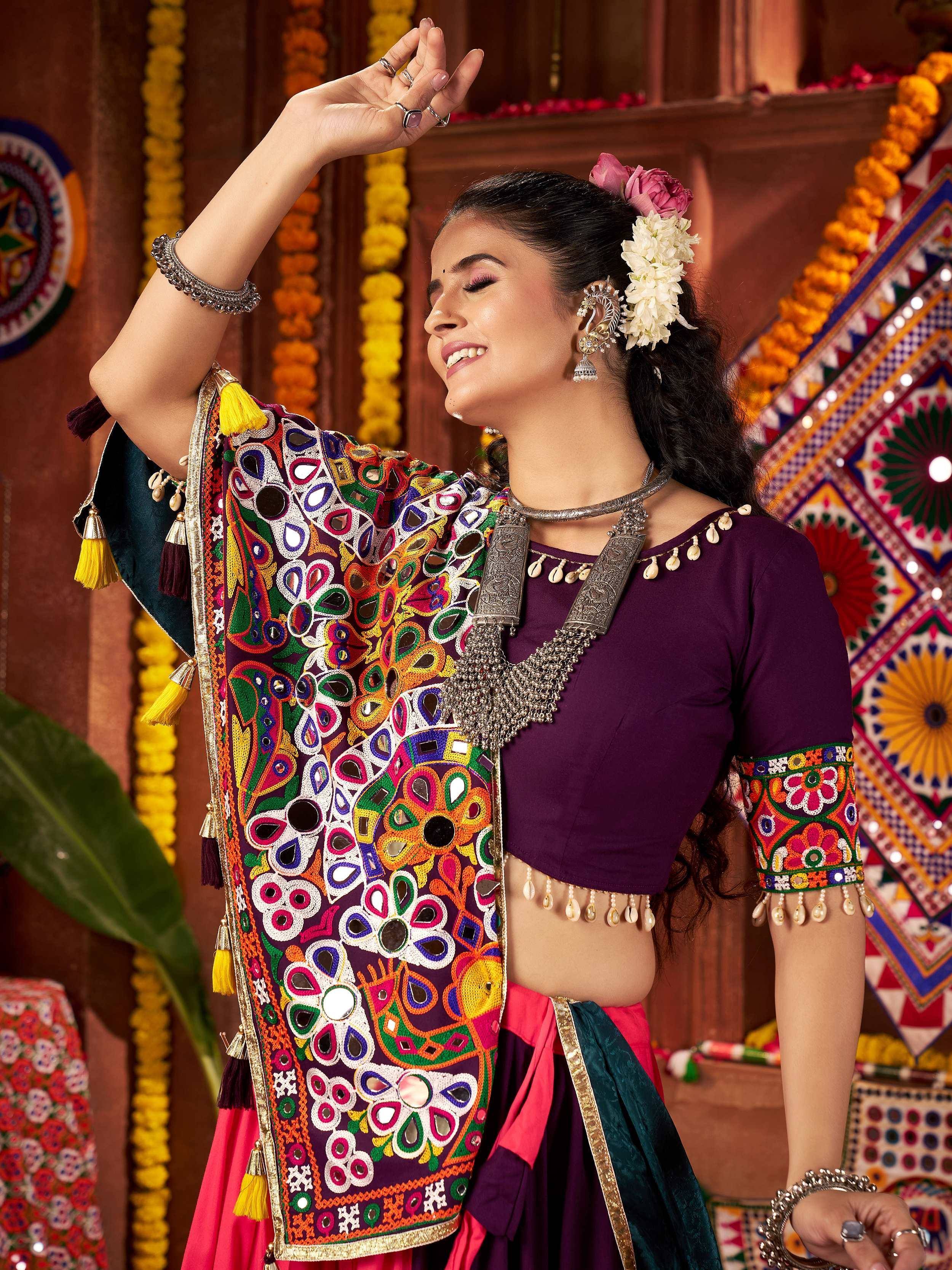 Vibrant Indian ethnic wear with mirror work and floral embroidery, perfect for festive occasions.