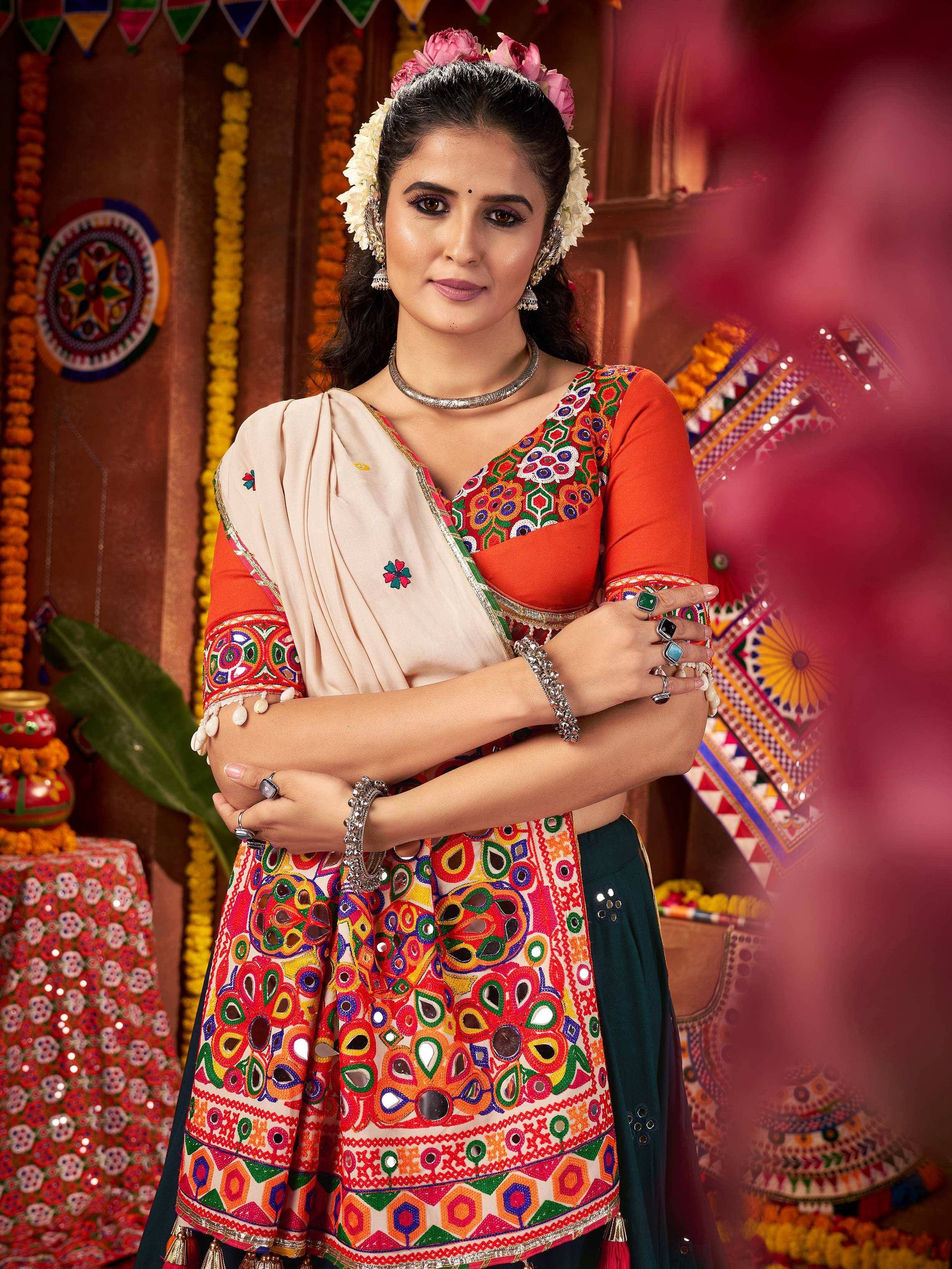 Vibrant Indian ethnic wear with mirror work and floral embroidery, perfect for festive occasions.