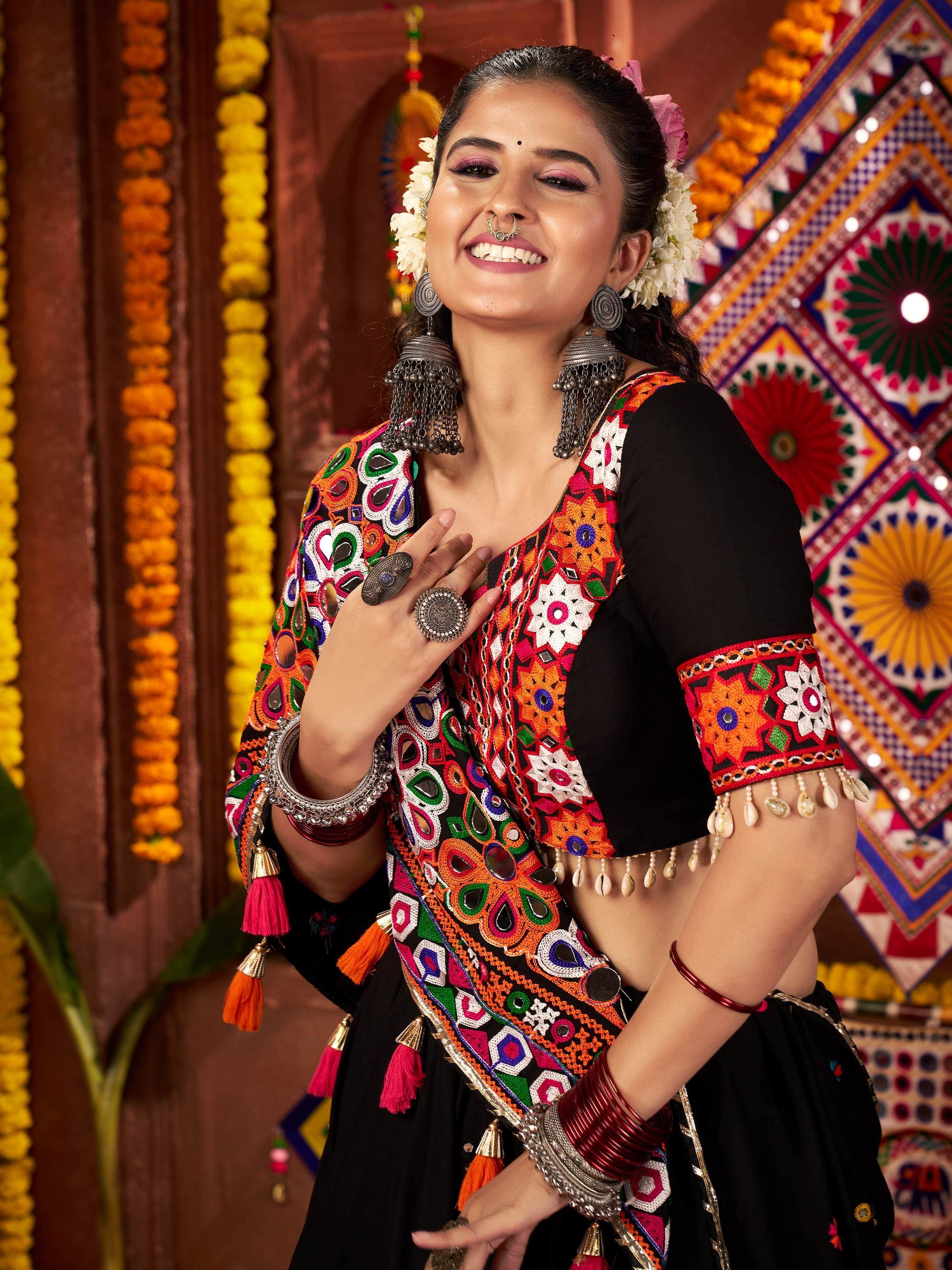 Vibrant Indian ethnic wear with colorful embroidery and traditional jewelry for festive occasions