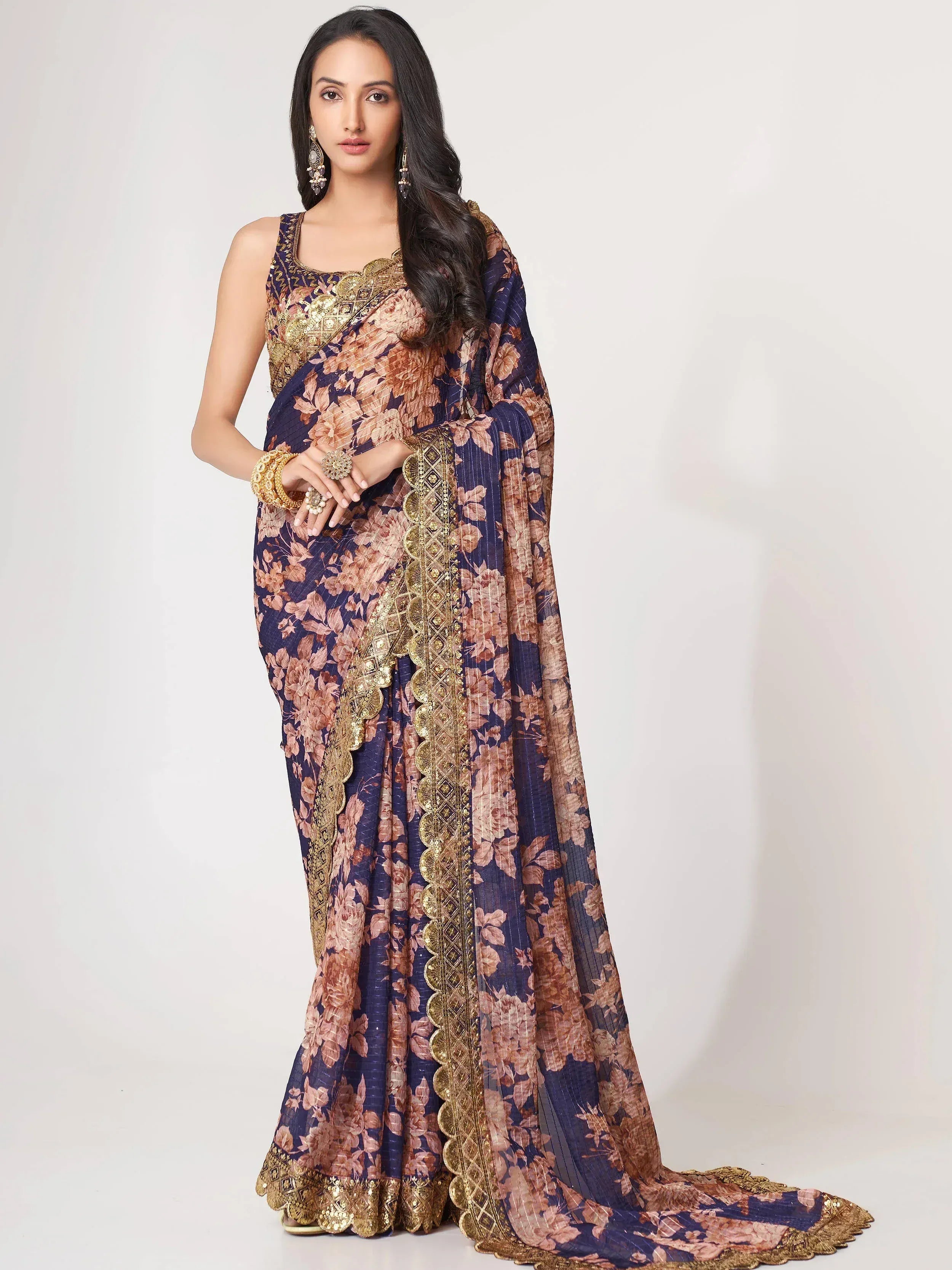 Navy blue floral saree with gold embroidery, perfect for Indian ethnic wear and festive occasions.