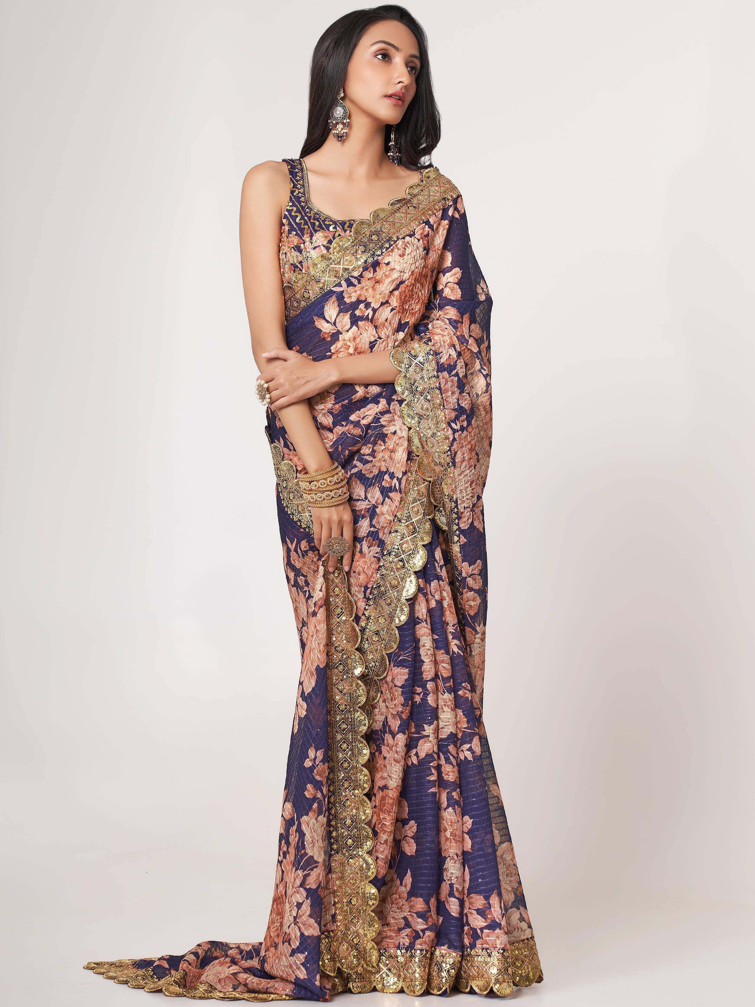 Elegant navy blue saree with gold embroidery and floral print, perfect for Indian ethnic occasions