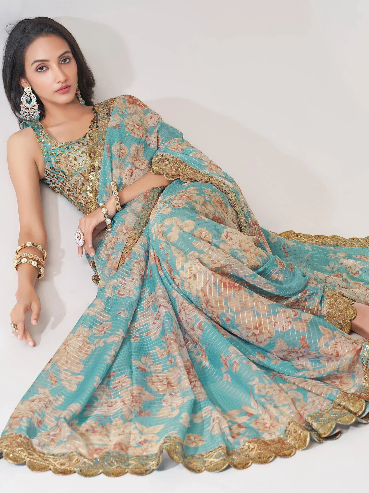 Turquoise floral lehenga choli with gold embroidery, perfect for Indian ethnic wear occasions