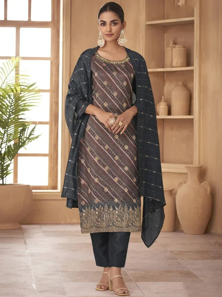Elegant ethnic salwar kameez with gold embroidery, paired with matching dupatta and pants, perfect for festive occasions.