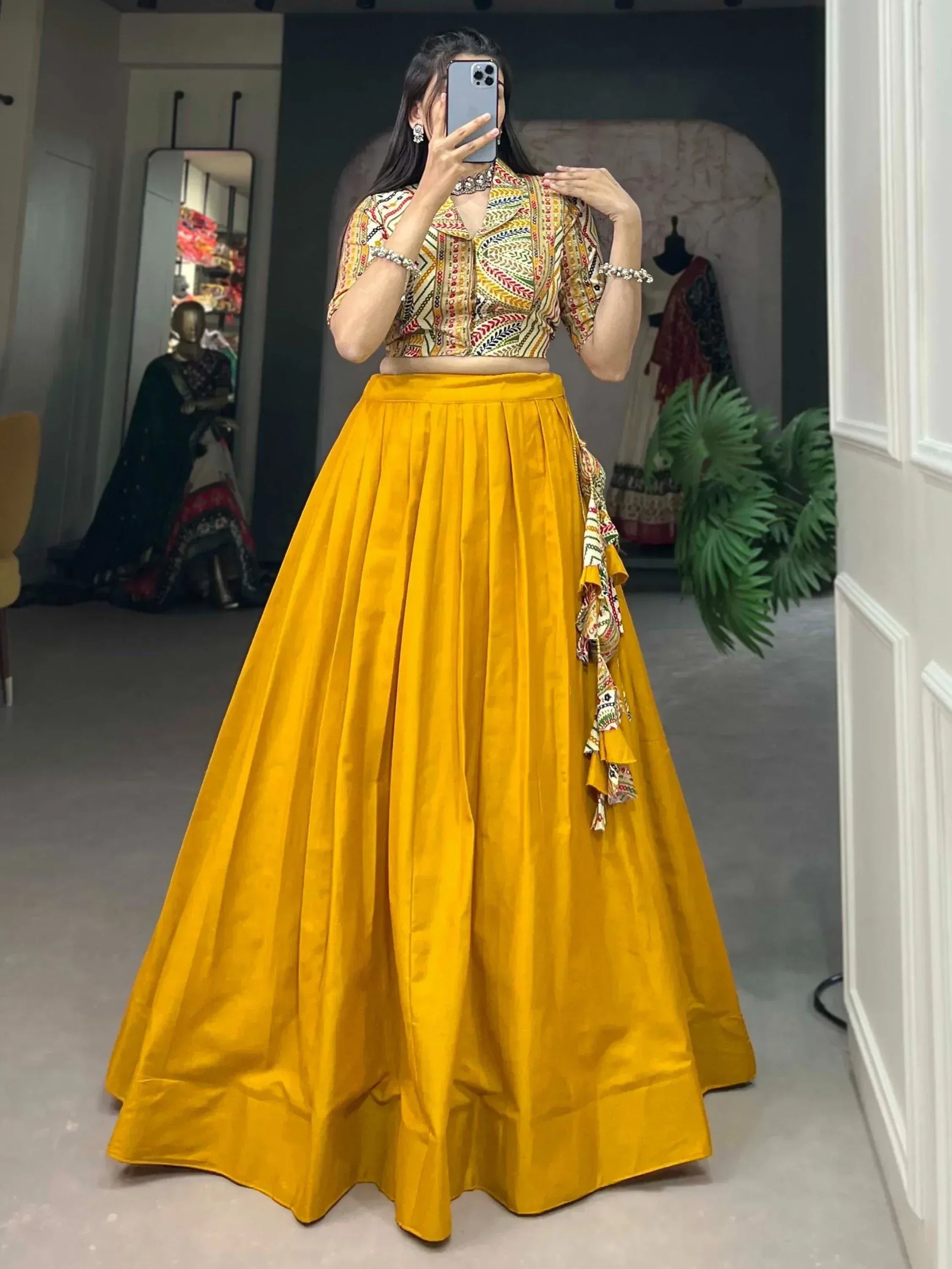 Yellow lehenga with printed crop top, ethnic Indian wear for women, mirror selfie in boutique