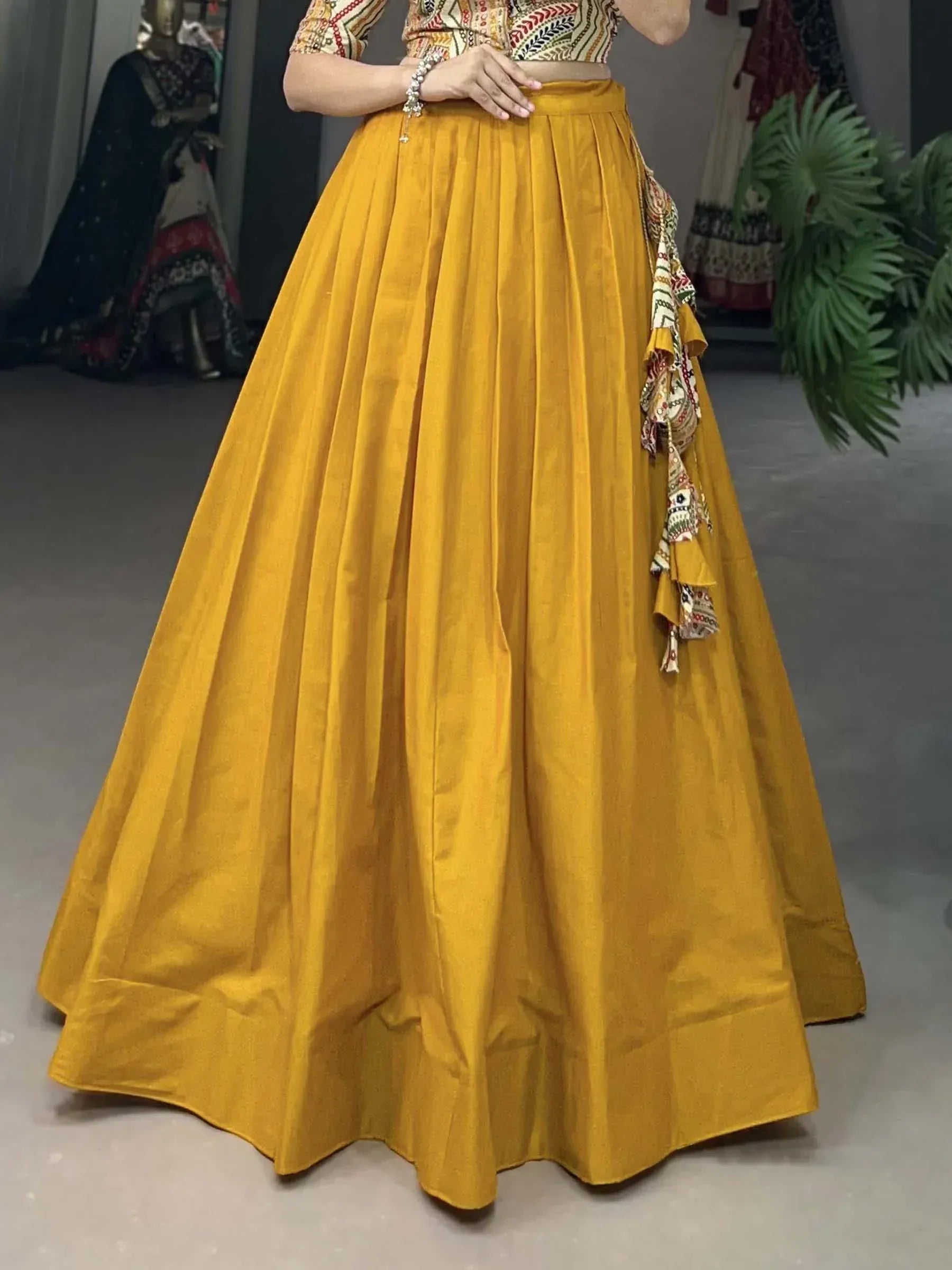 Mustard yellow pleated lehenga with printed crop top, ethnic Indian wear for women