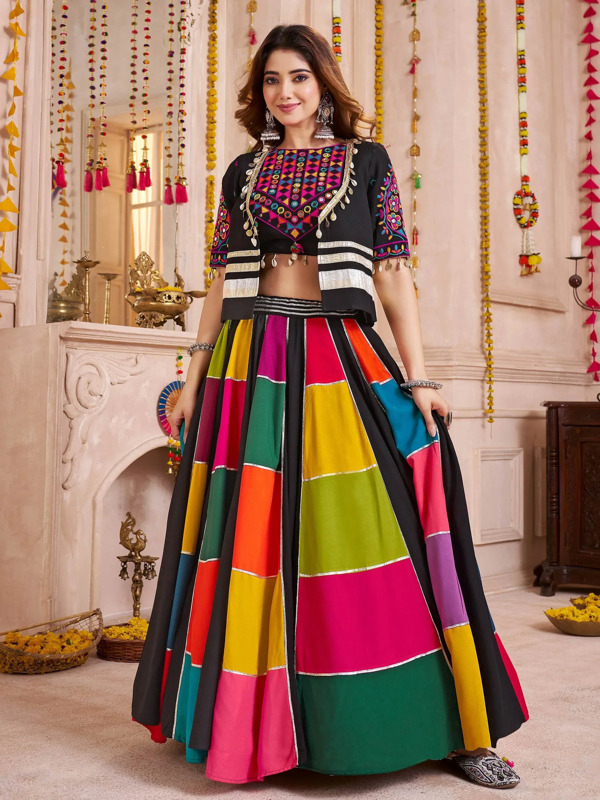 Colorful Indian ethnic lehenga choli with mirror work and patchwork skirt, perfect for festive occasions.