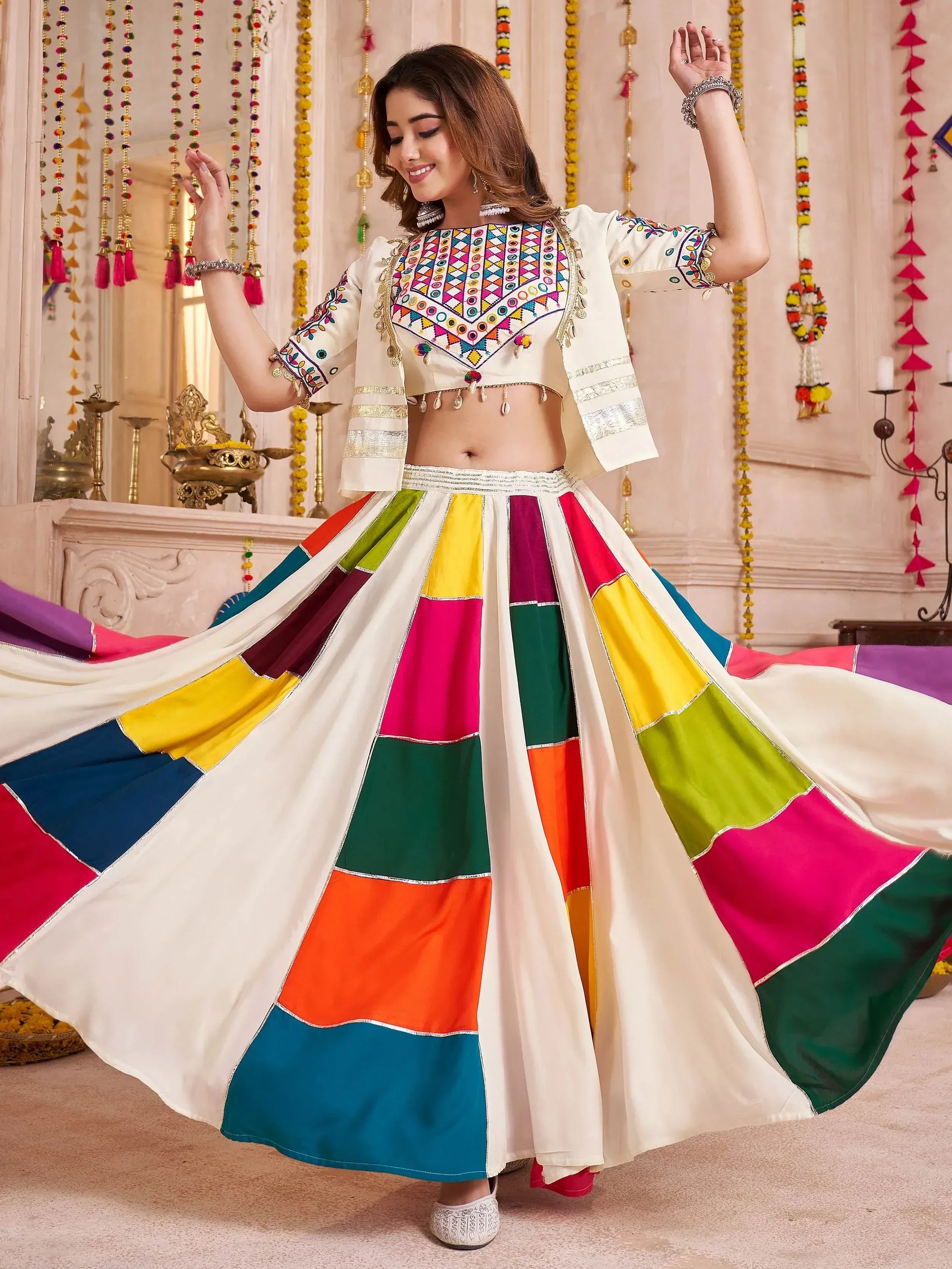 Colorful Indian ethnic wear with embroidered crop top and patchwork skirt, perfect for festive occasions
