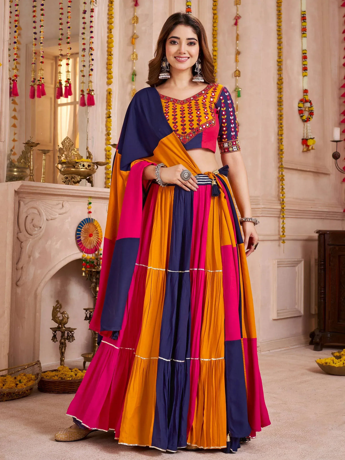 Colorful Indian ethnic lehenga choli with mirror work, perfect for festive occasions and celebrations.