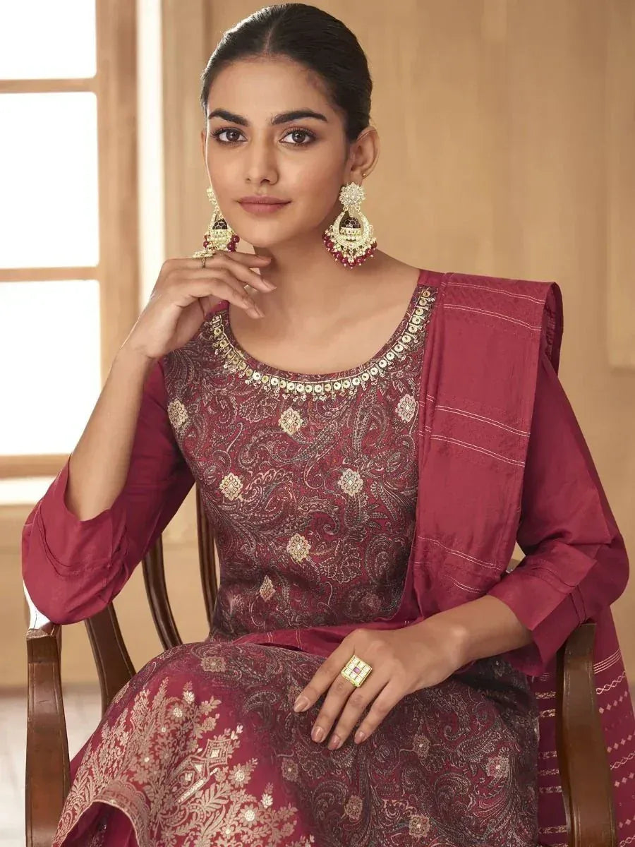 Elegant maroon ethnic salwar kameez with gold embroidery, perfect for festive occasions and weddings.