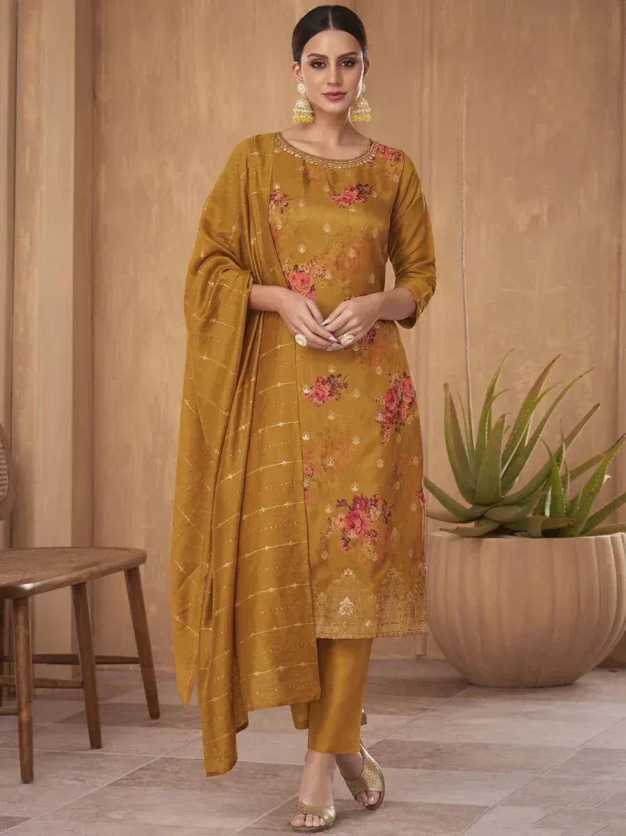 Woman wearing mustard floral embroidered salwar kameez with dupatta, traditional Indian attire