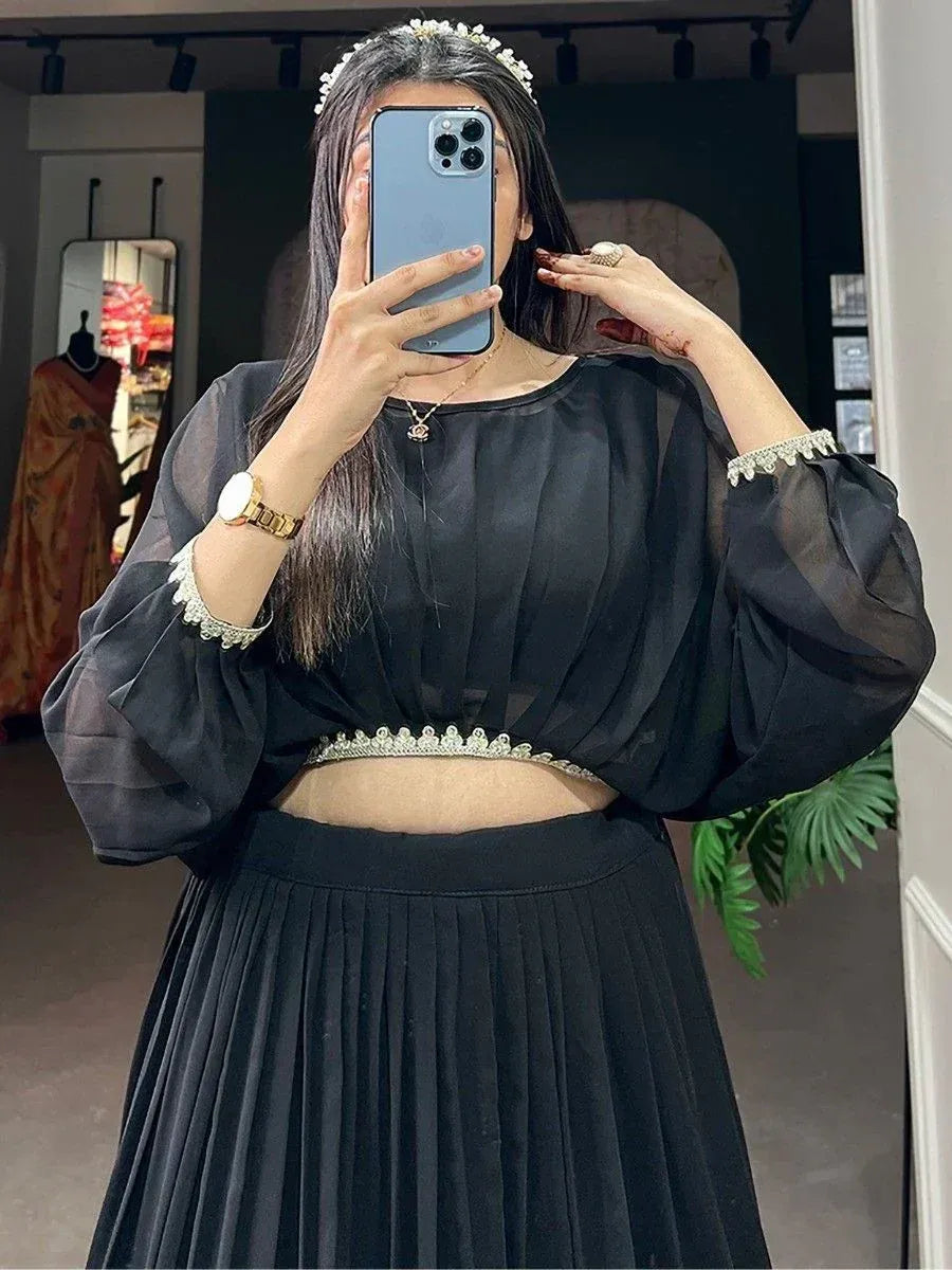 Black ethnic crop top with embellished sleeves and pleated skirt, perfect for Indian wear occasions