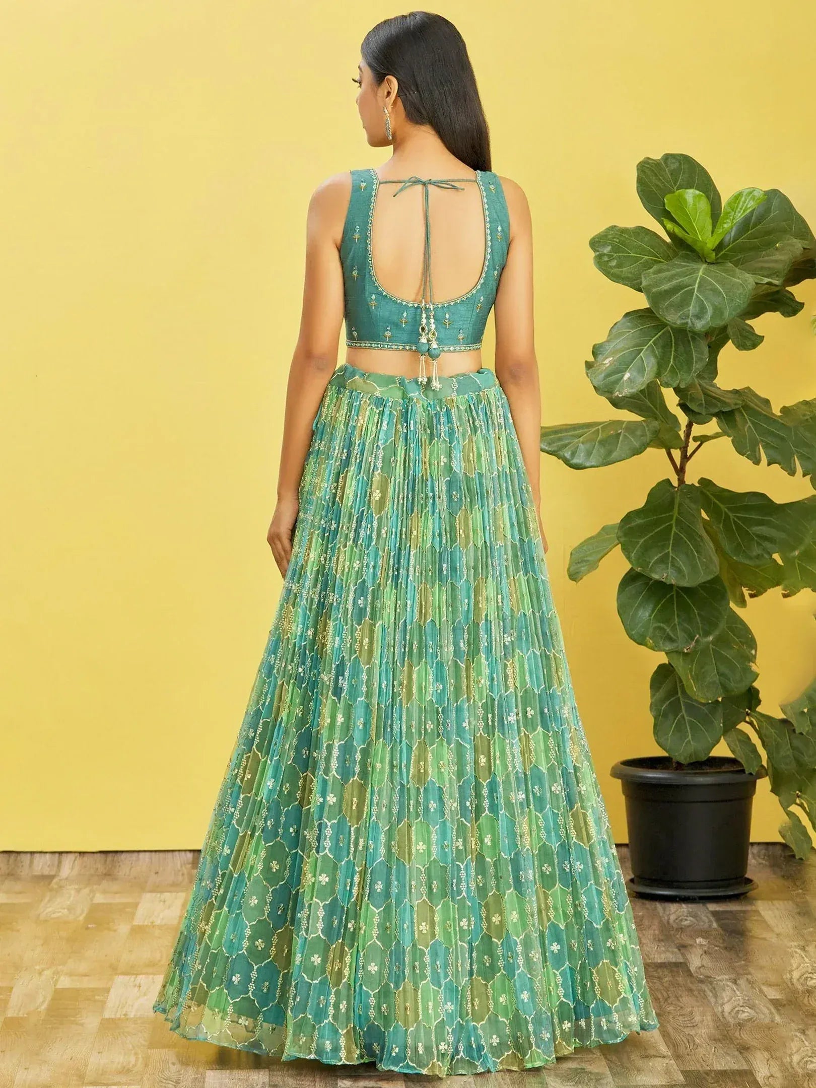 Green printed lehenga choli with back tie design, perfect for ethnic occasions