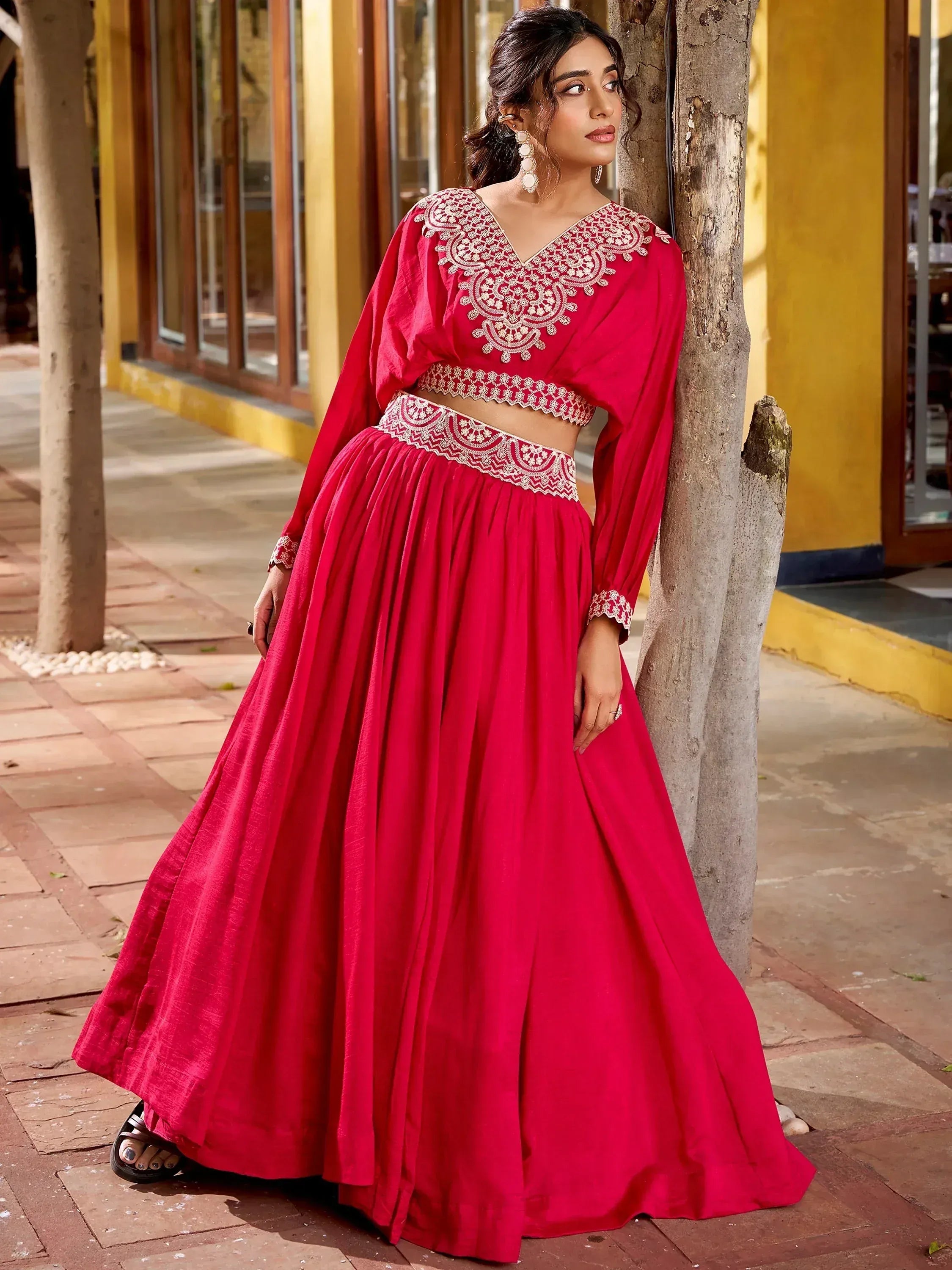 Red embroidered lehenga choli with V-neck blouse and flared skirt, perfect for Indian ethnic occasions