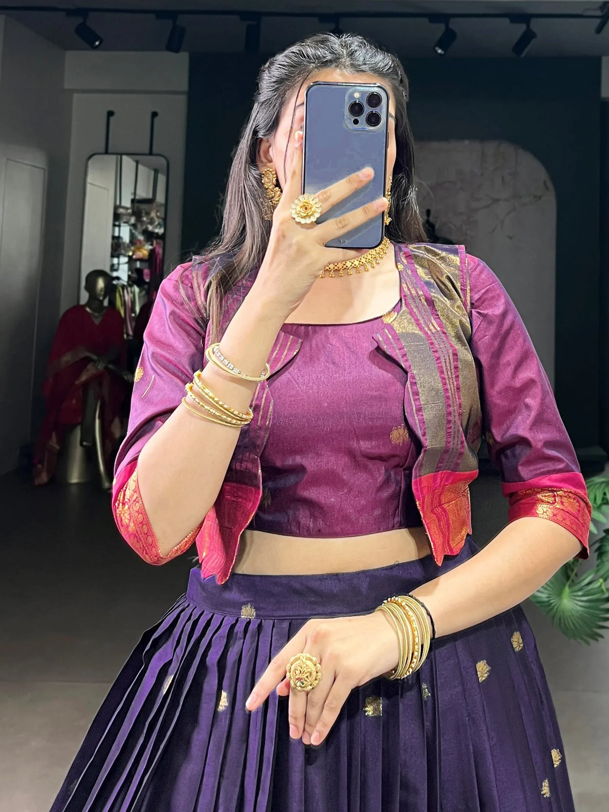 Purple ethnic lehenga choli with gold embroidery and matching jewelry