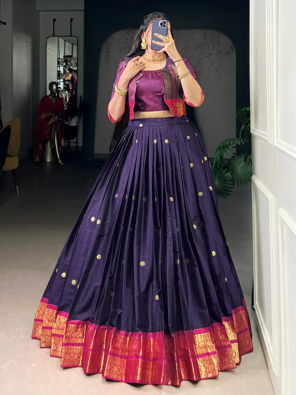 Purple lehenga choli with gold embroidery and pink border, perfect for Indian ethnic wear occasions