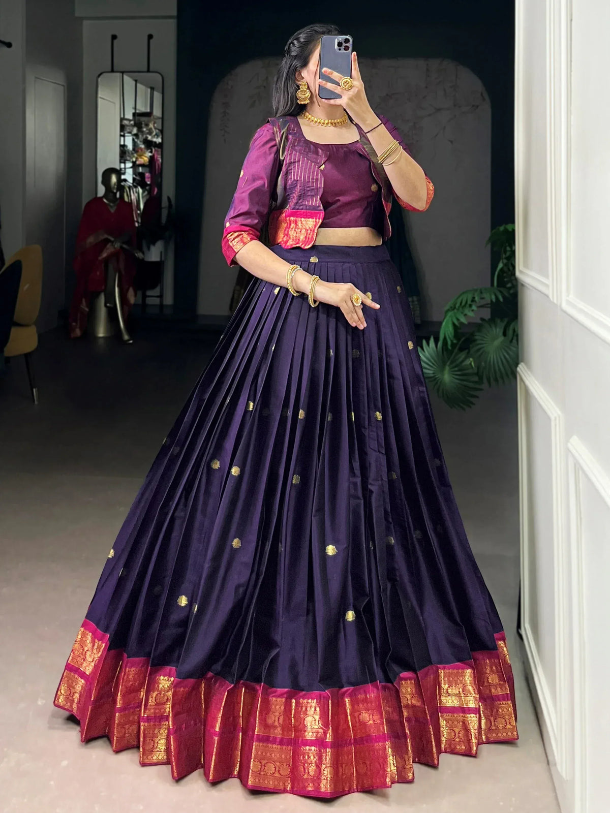Purple lehenga choli with gold embroidery and red border, perfect for Indian ethnic wear