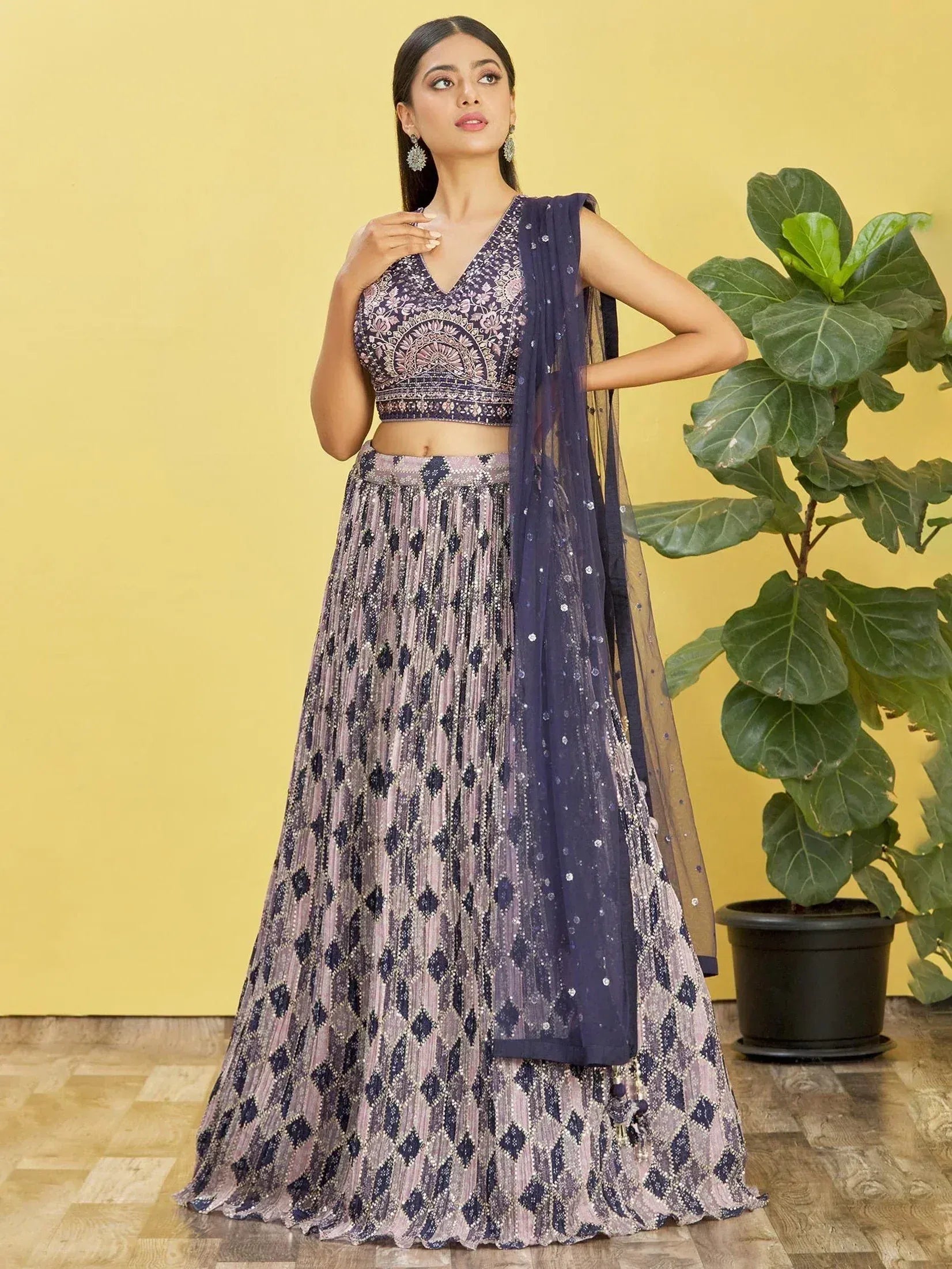 Elegant purple and pink embroidered lehenga choli with sequin dupatta, perfect for Indian ethnic occasions