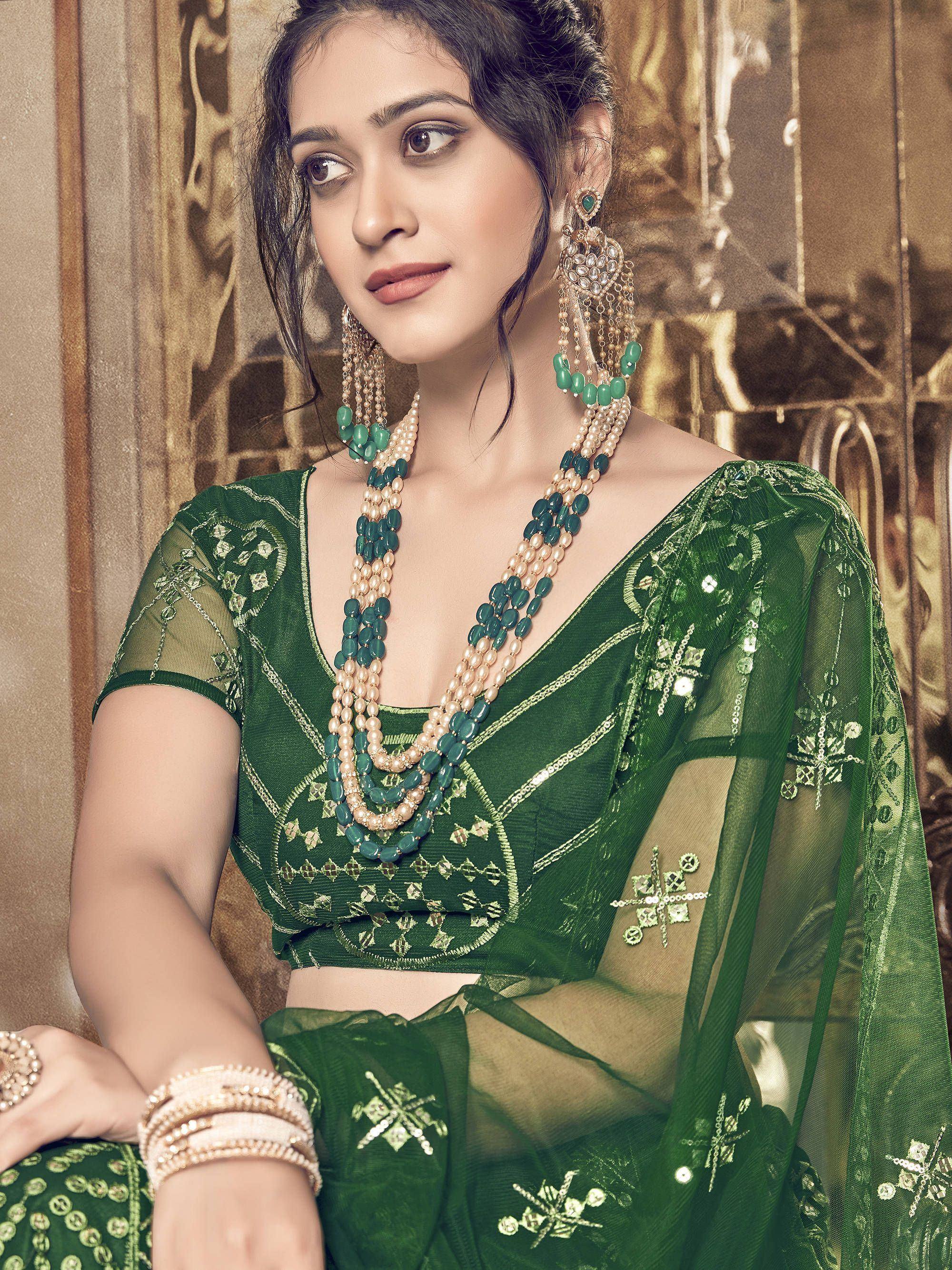 Green embroidered saree with matching jewelry, perfect for Indian ethnic occasions and festive wear.