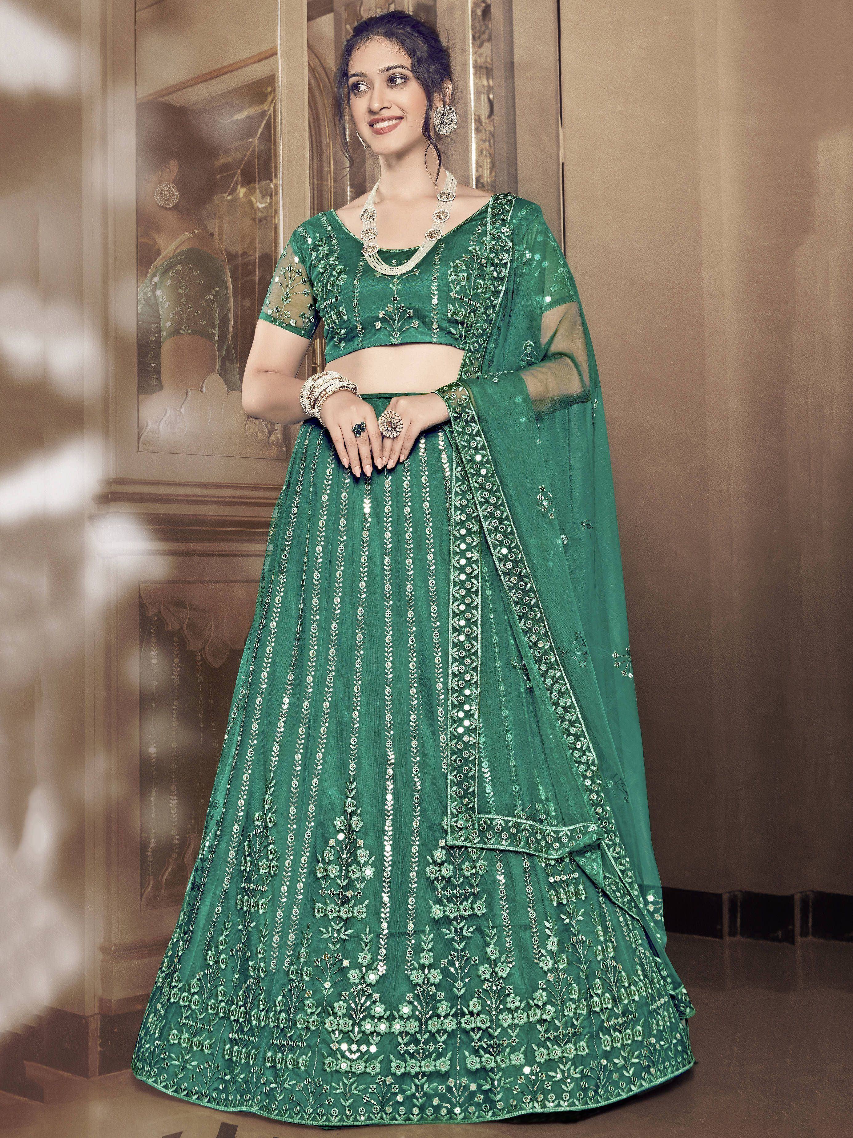Emerald green embroidered lehenga choli with sheer dupatta, perfect for Indian weddings and festive occasions.