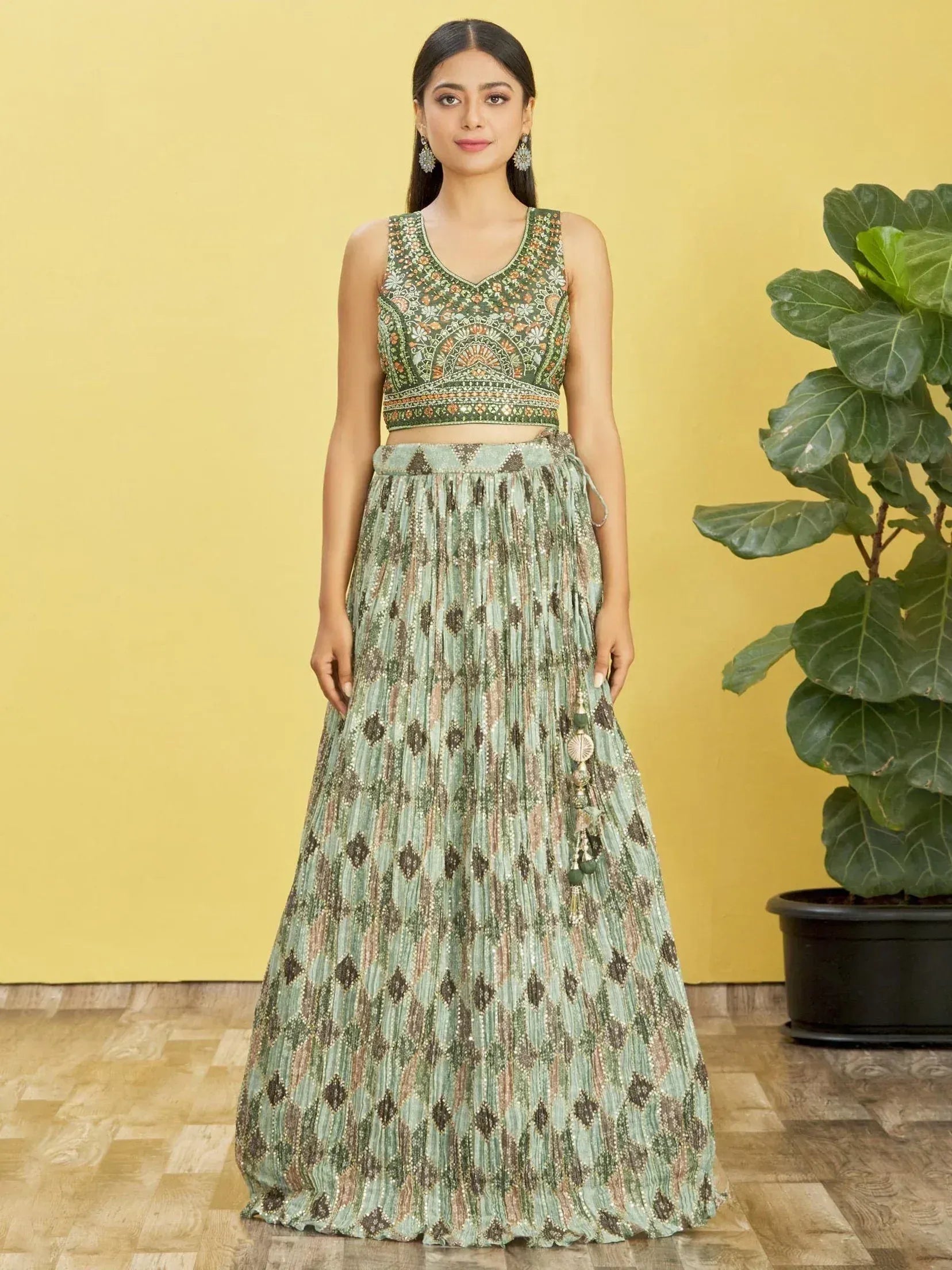 Green embroidered lehenga choli with pleated skirt, perfect for Indian ethnic wear occasions