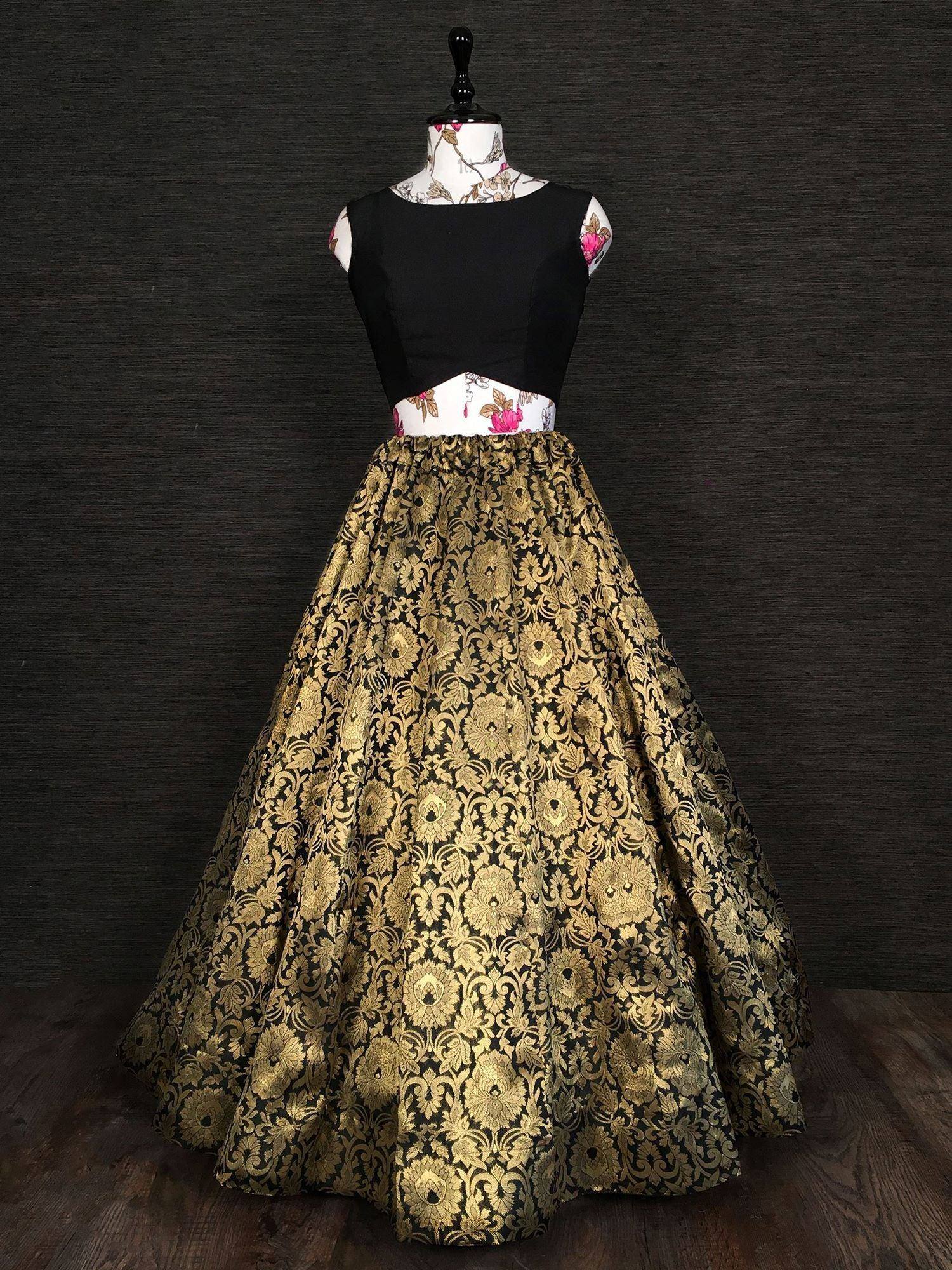 Black and gold floral print lehenga choli with sleeveless top, perfect for Indian ethnic wear occasions