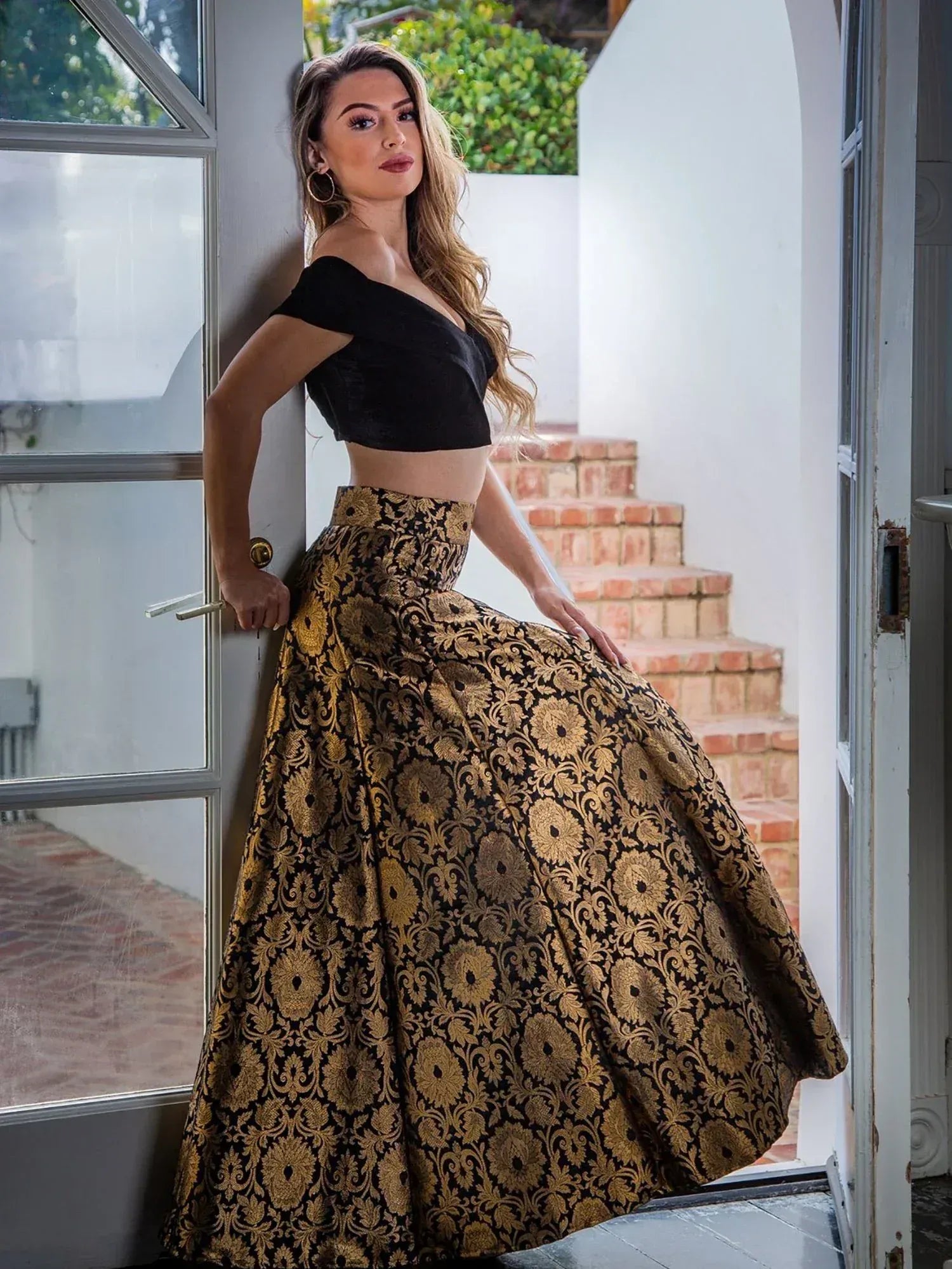 Black off-shoulder crop top with gold floral print lehenga skirt, ethnic wear for women