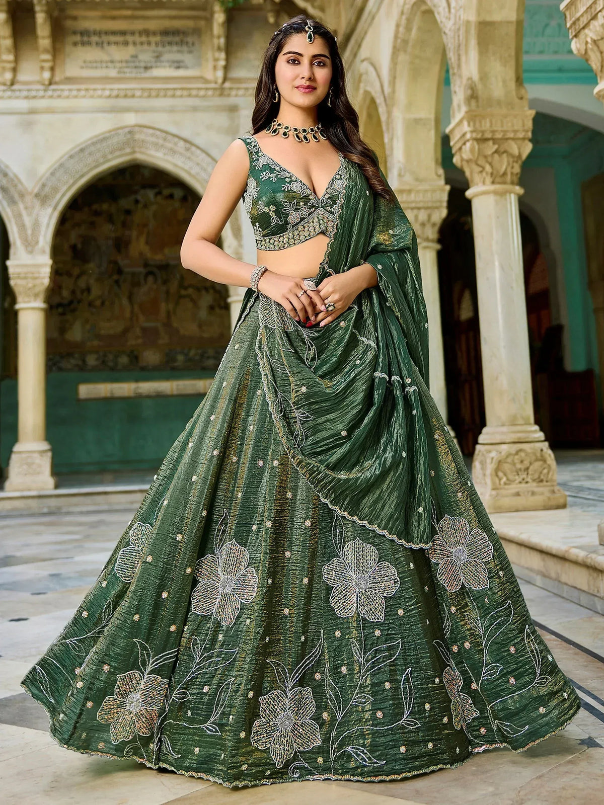 Emerald green designer lehenga choli with floral embroidery, perfect for Indian weddings and festive occasions