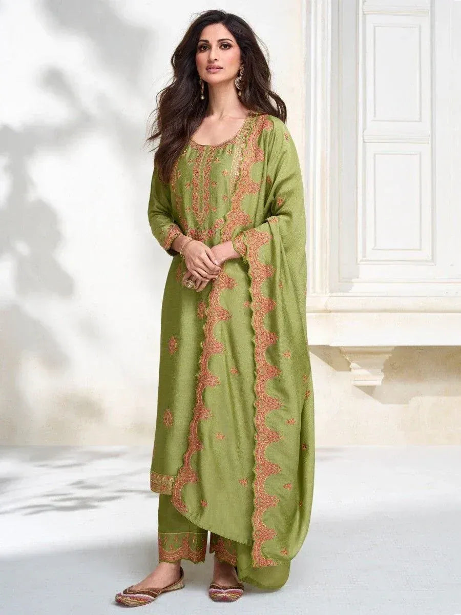 Green embroidered salwar kameez with orange detailing, stylish ethnic wear for women