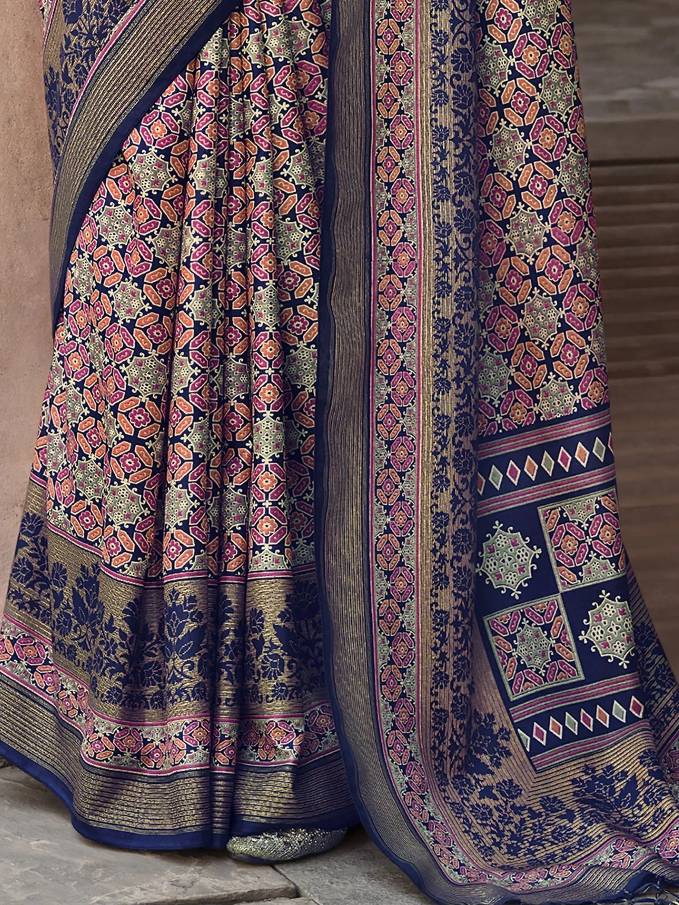 Navy blue saree with intricate floral and geometric prints, gold zari border, perfect for ethnic occasions