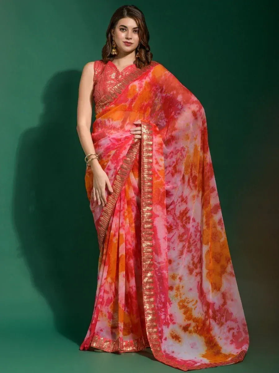 Vibrant tie-dye saree with gold border, styled with sleeveless blouse for ethnic occasions